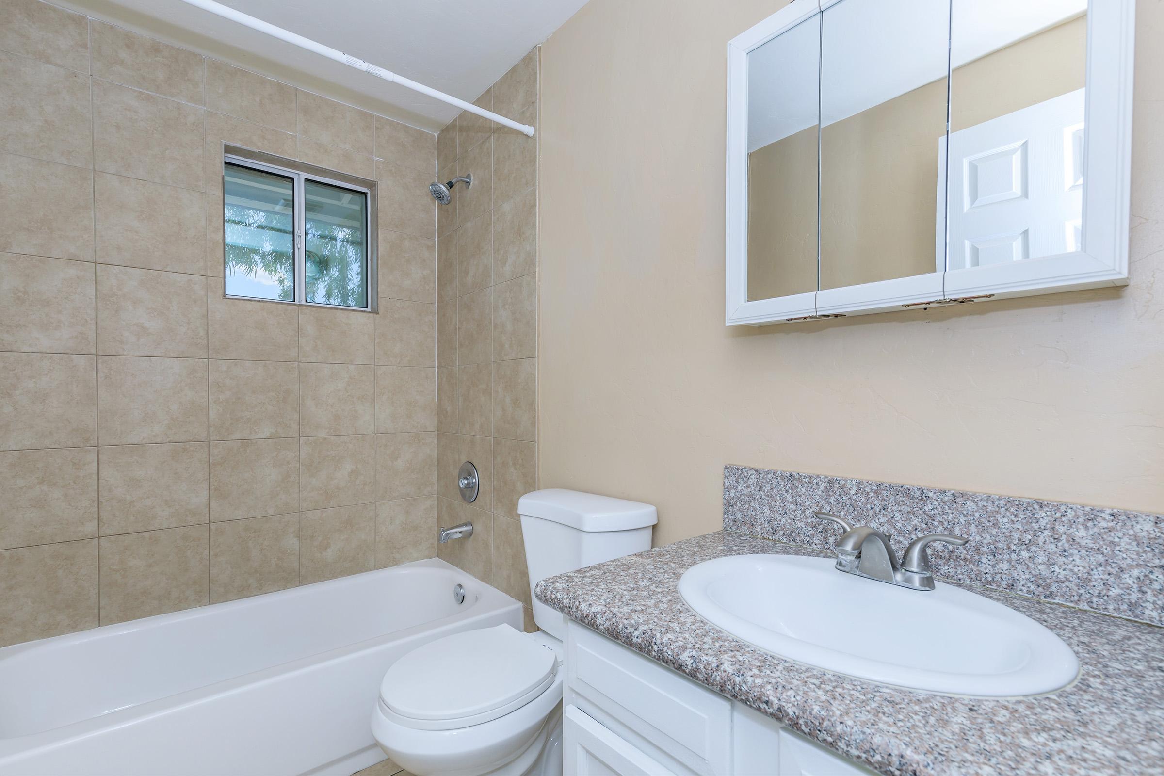 a close up of a sink and a bath tub