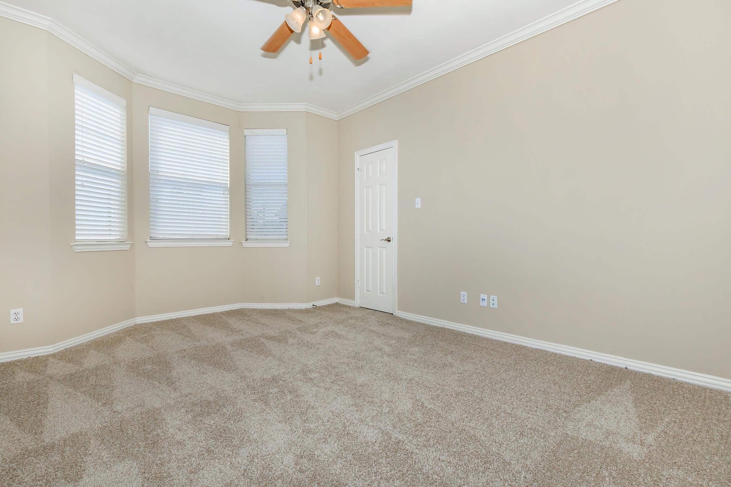 a bedroom with a large window