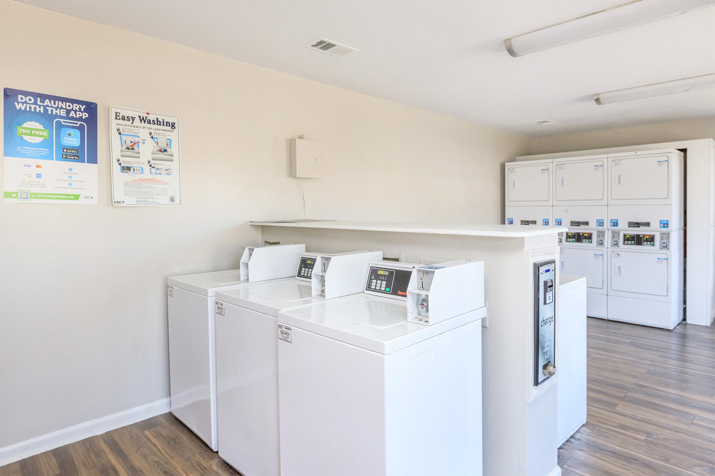 a kitchen with a sink and a refrigerator