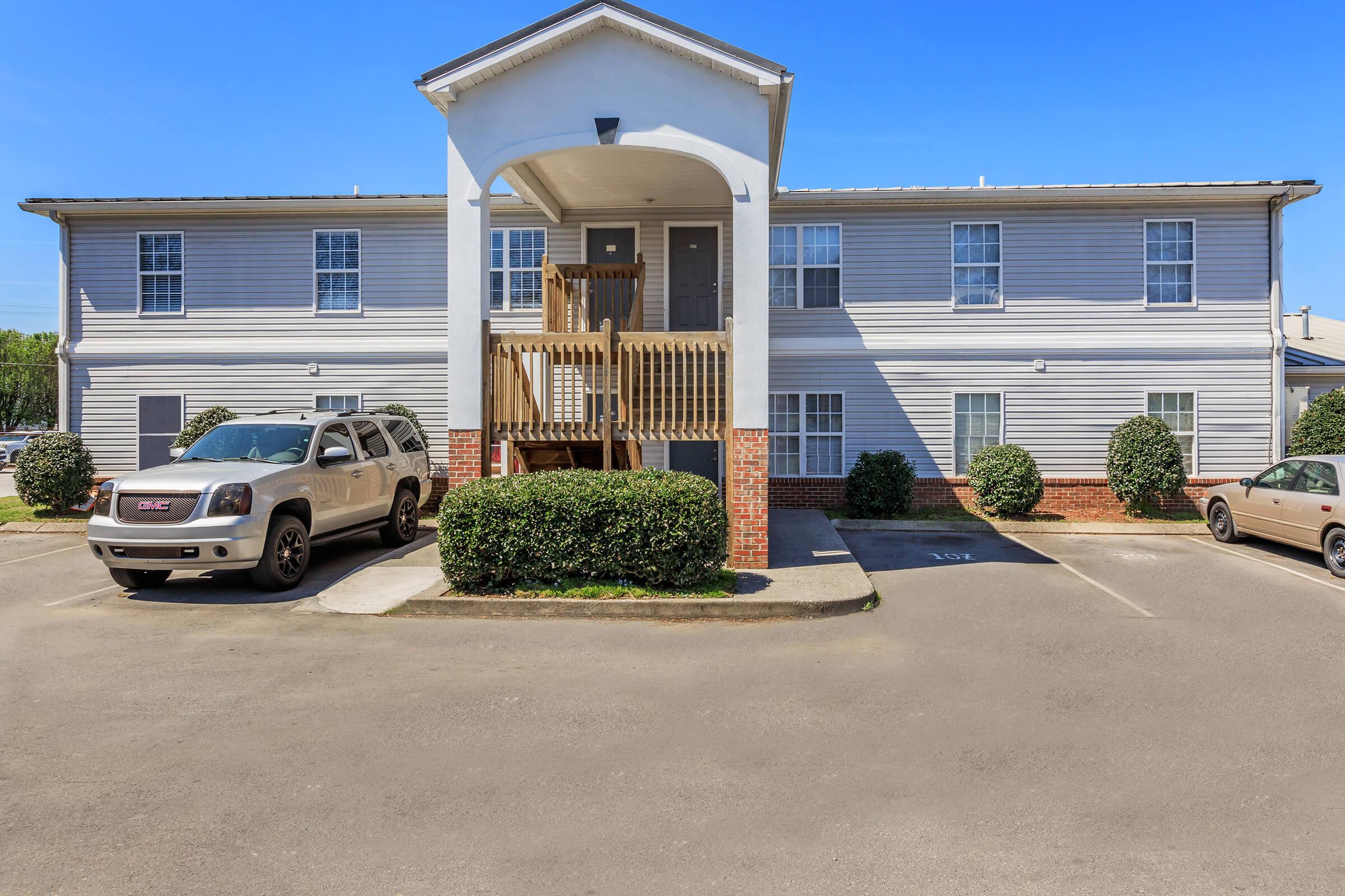 a parking lot in front of a house