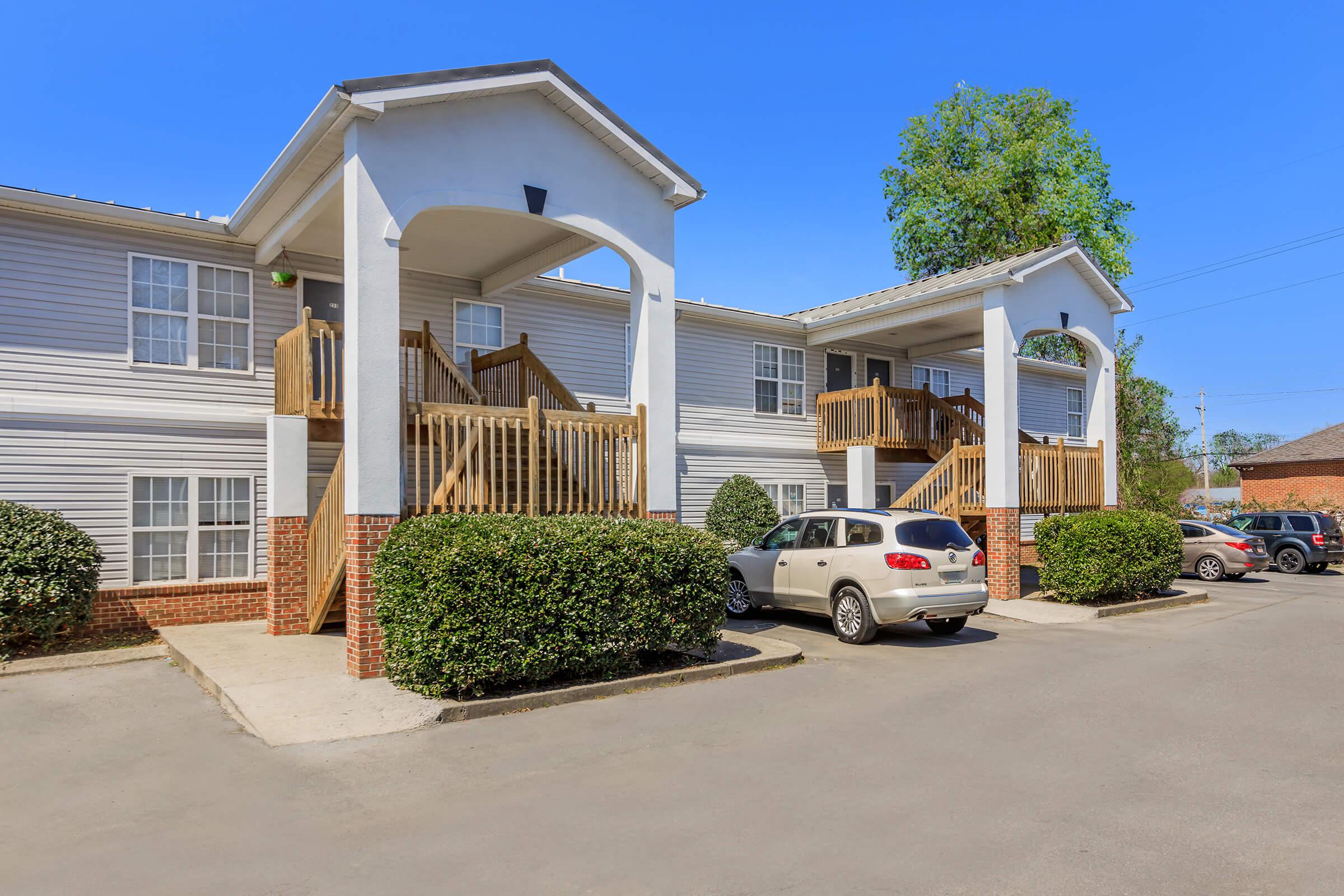 a parking lot in front of a house