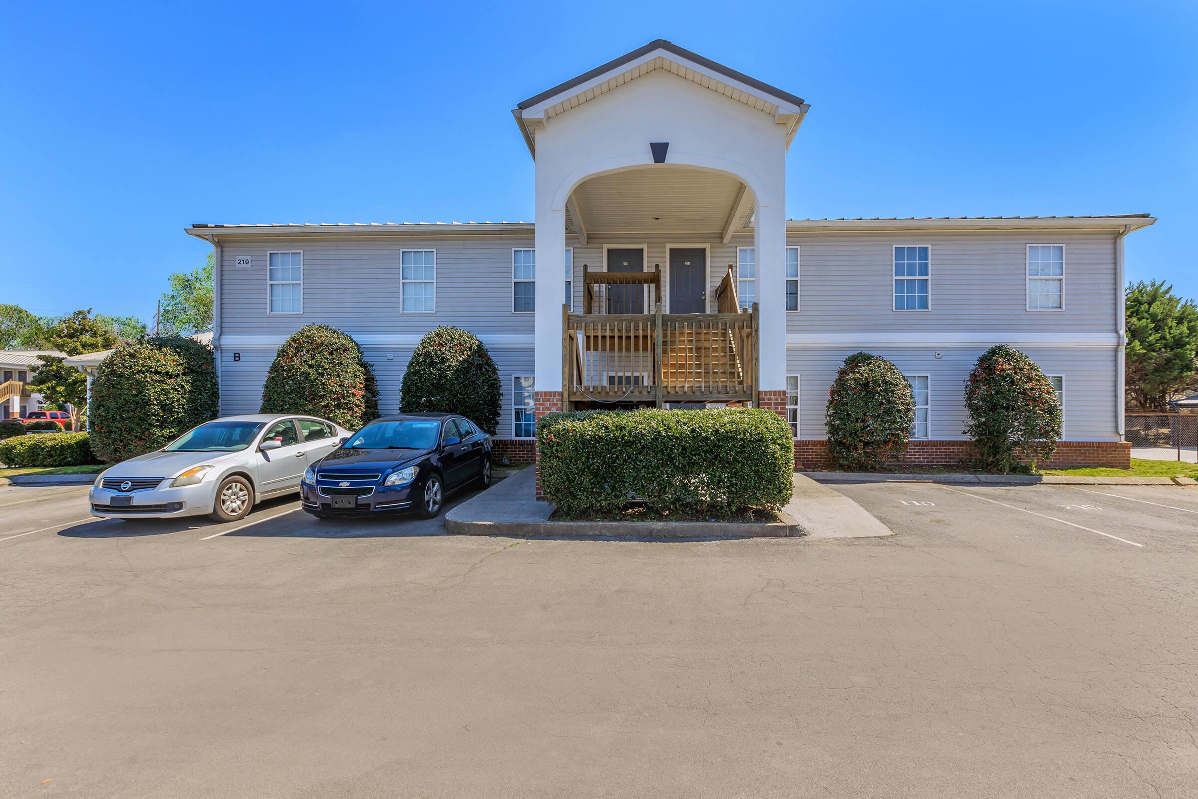 a parking lot in front of a house