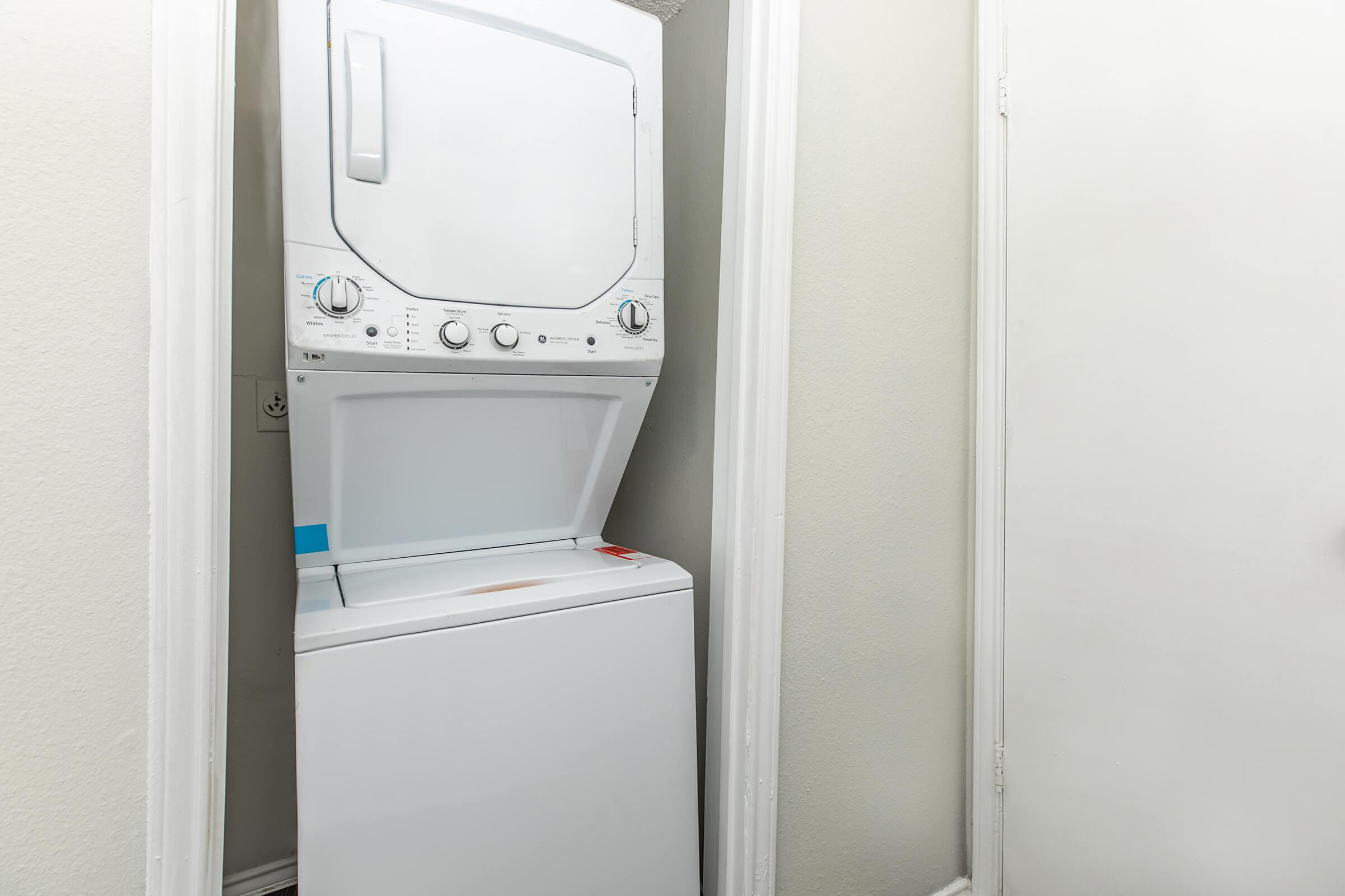 a refrigerator freezer sitting next to a door