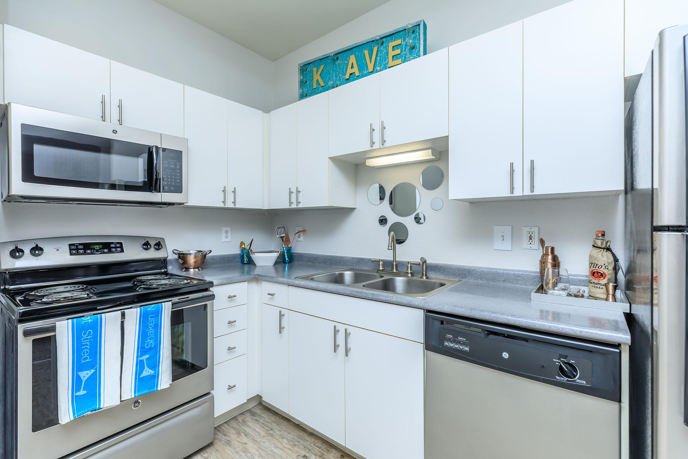 a kitchen with a stove and a microwave