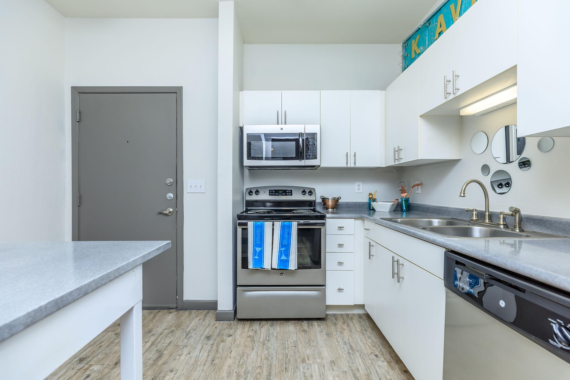 a kitchen with a stove and a sink