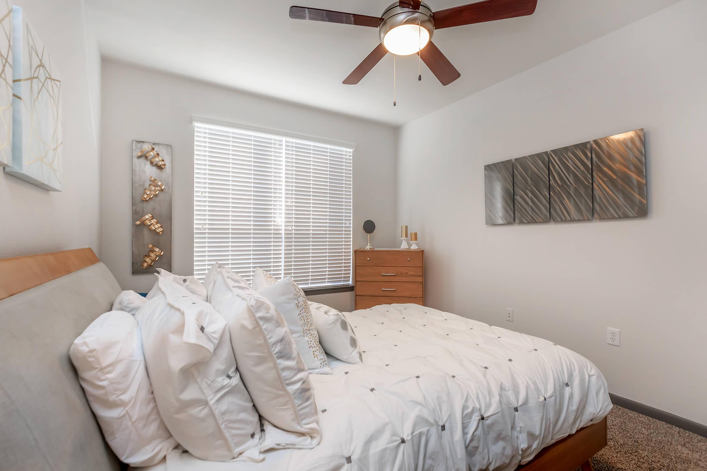 a bedroom with a large bed in a room