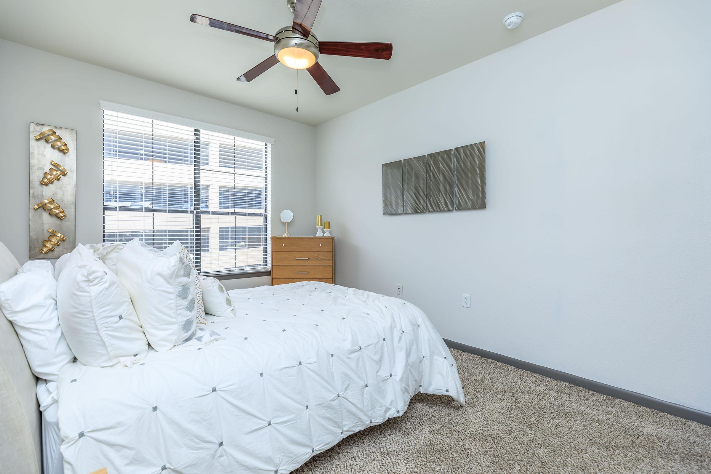 ELEGANT BEDROOM WITH CEILING FAN