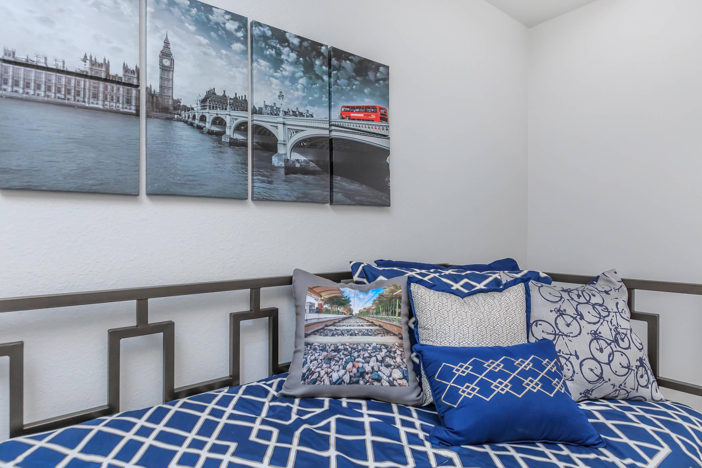 a blue and white bed in a room