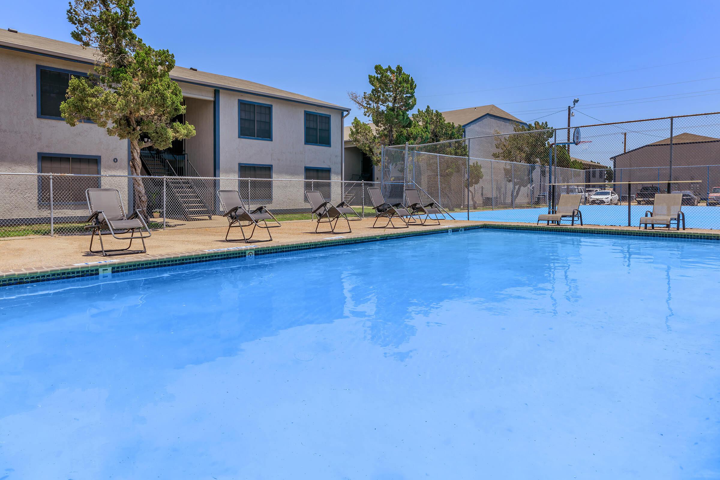 a large pool of water in front of a house