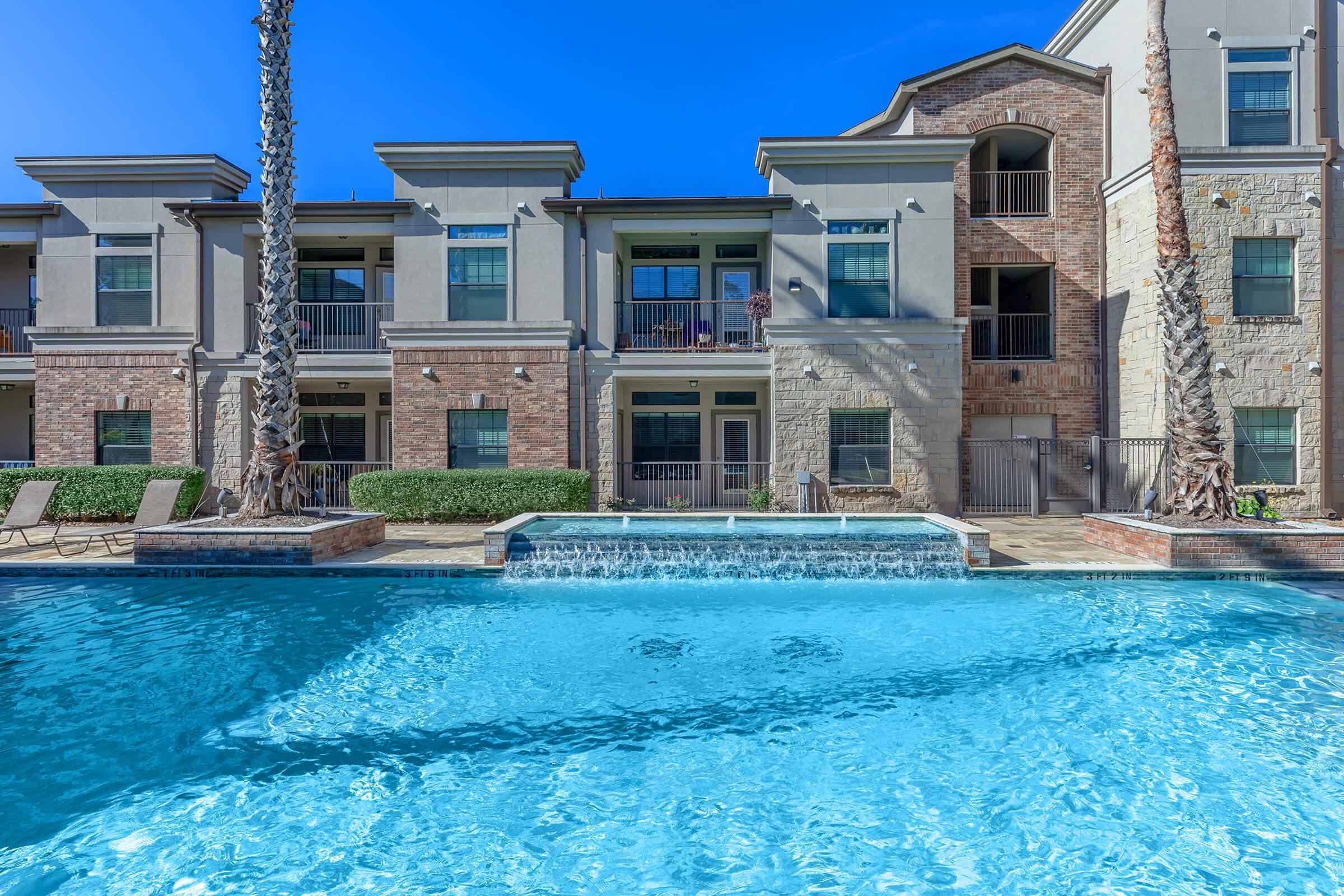 a large pool of water in front of a building