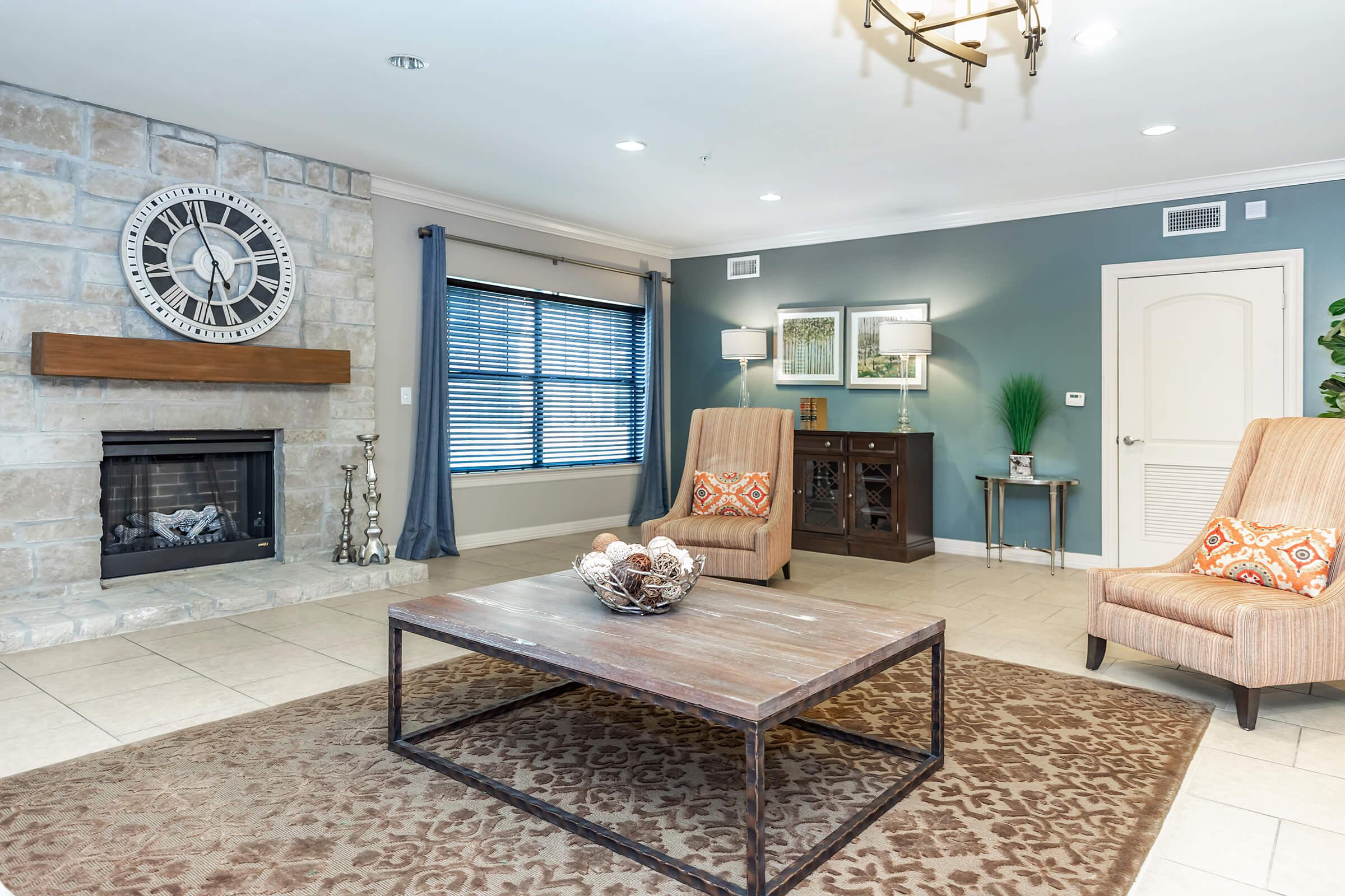 a living room filled with furniture and a fireplace