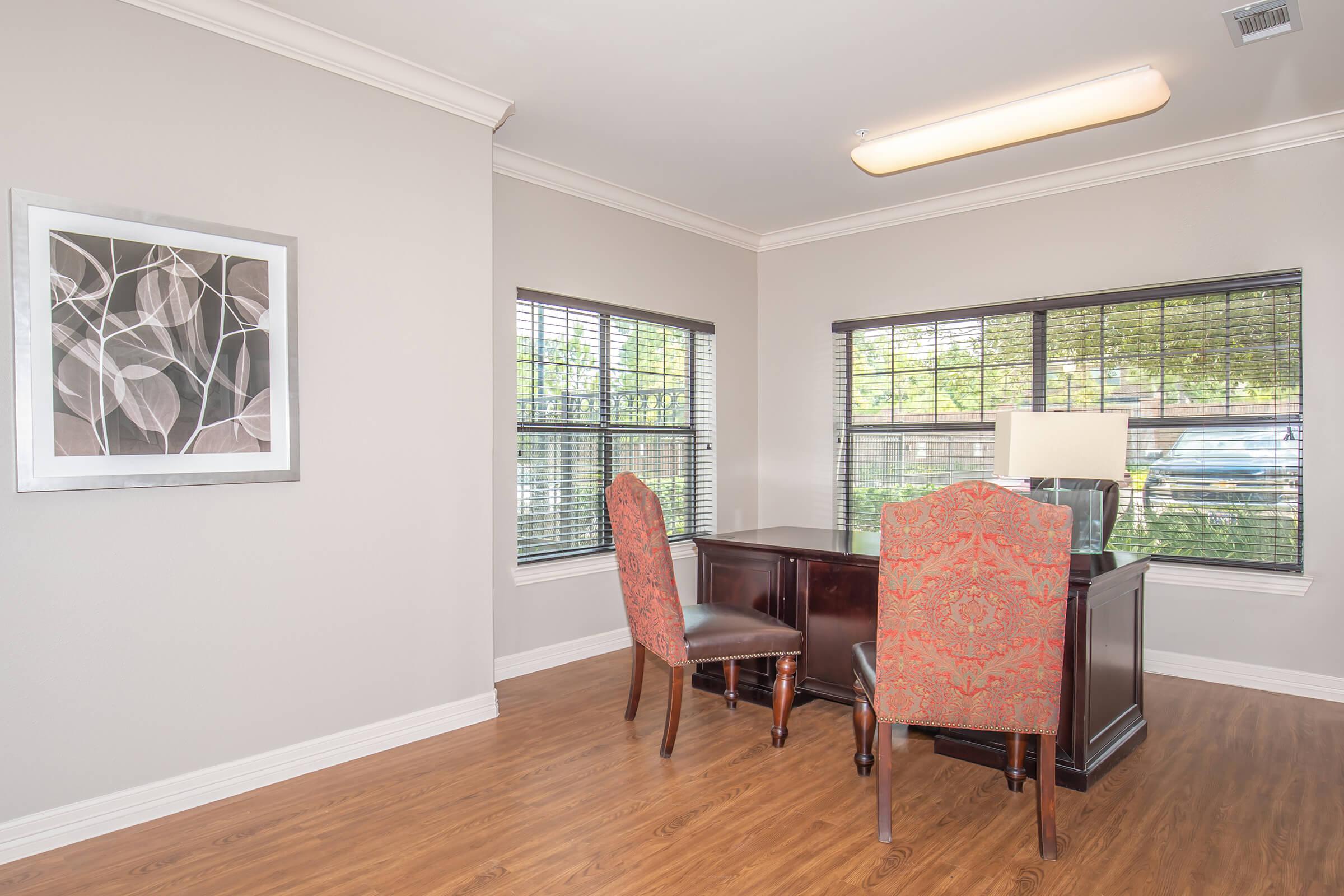 a living room filled with furniture and a large window