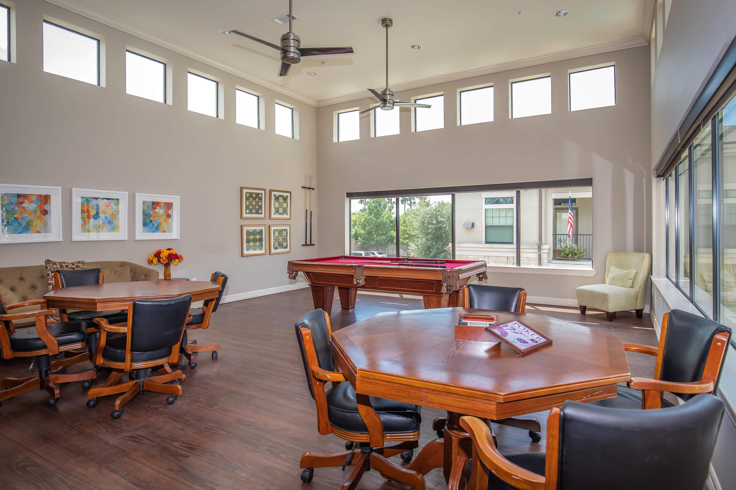 a living room filled with furniture and a large window