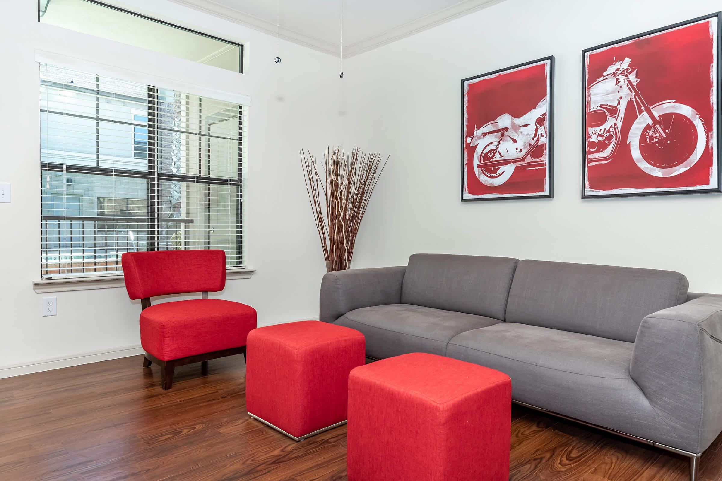 a living room filled with furniture and a rug