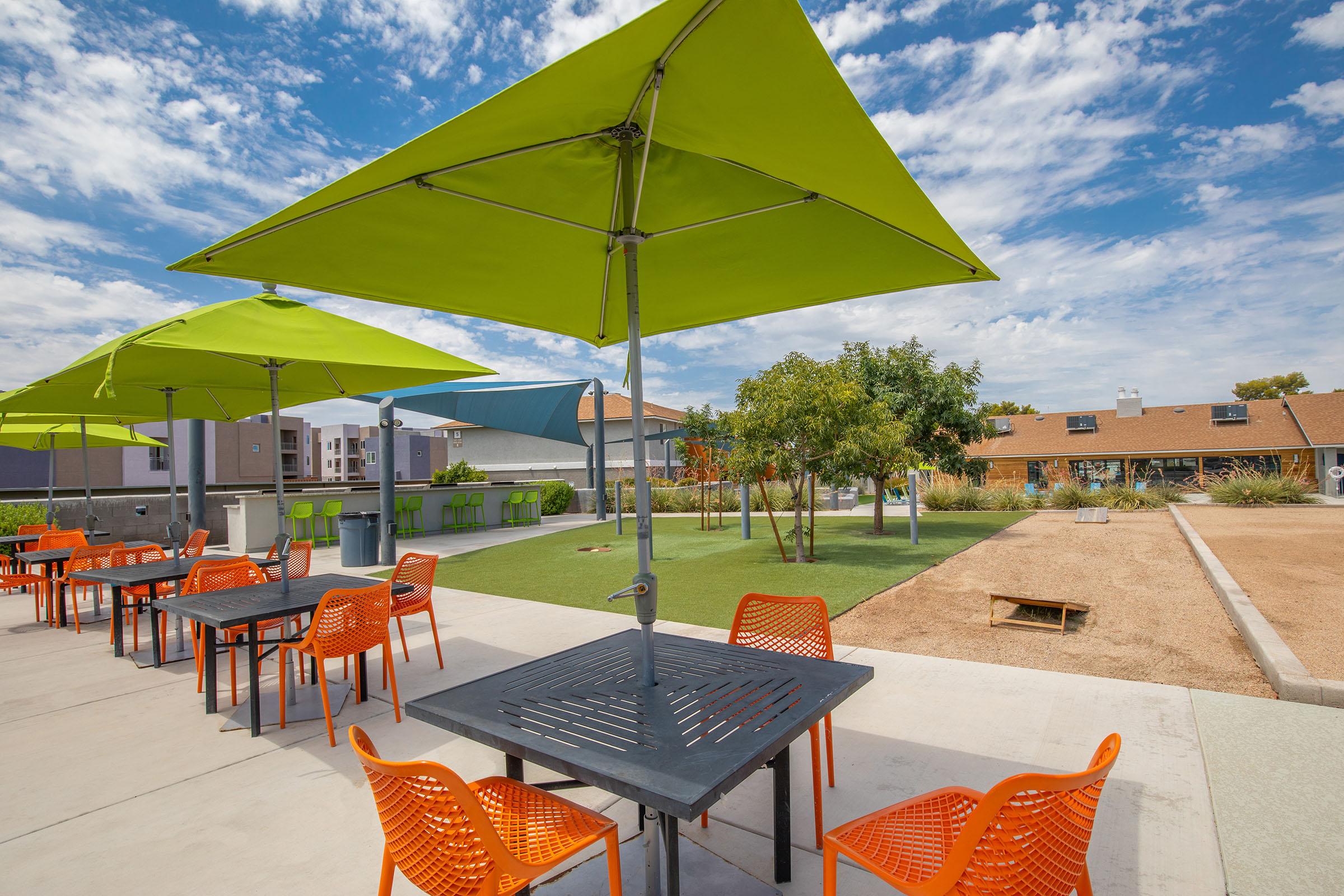 Rise at the District Mesa apartments outdoor patio with tables and chairs