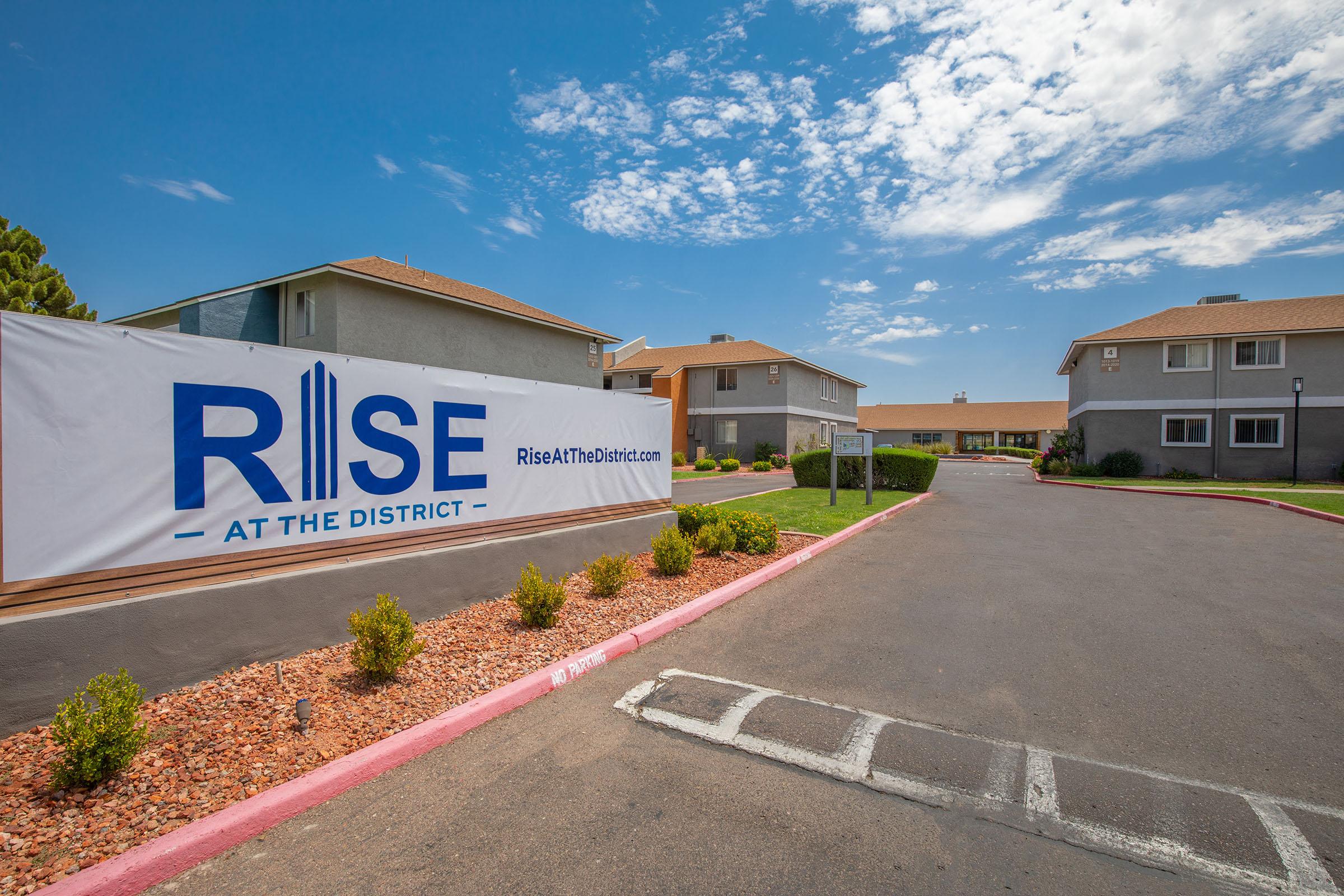 Rise at the District outdoor  welcome sign by the side of the road into the Mesa, AZ apartment complex