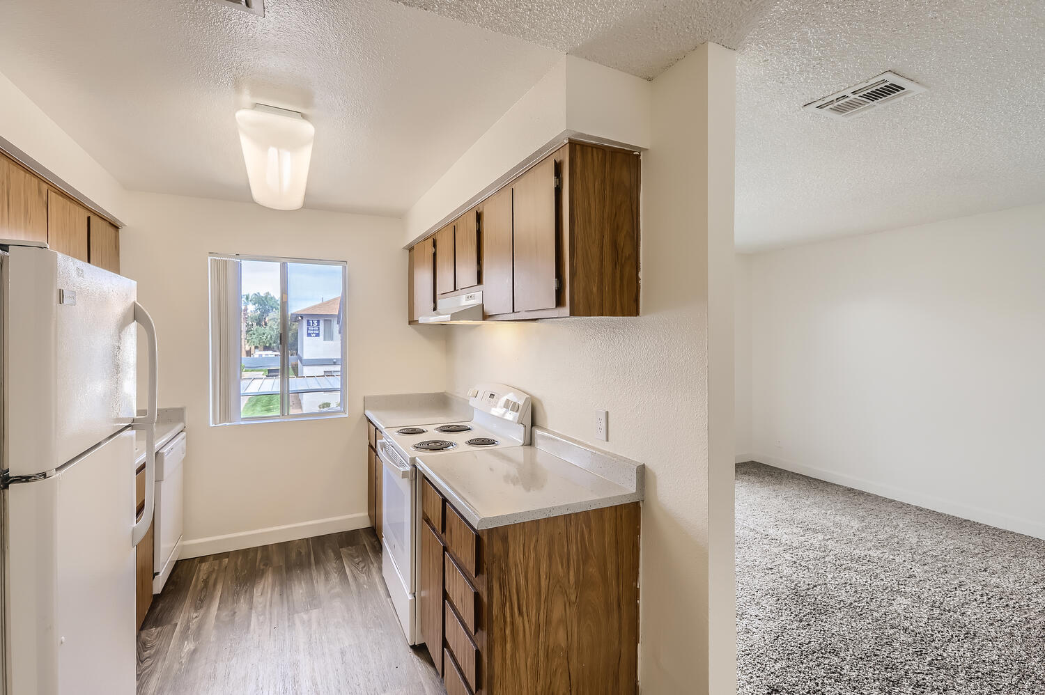 a kitchen with a sink and a mirror