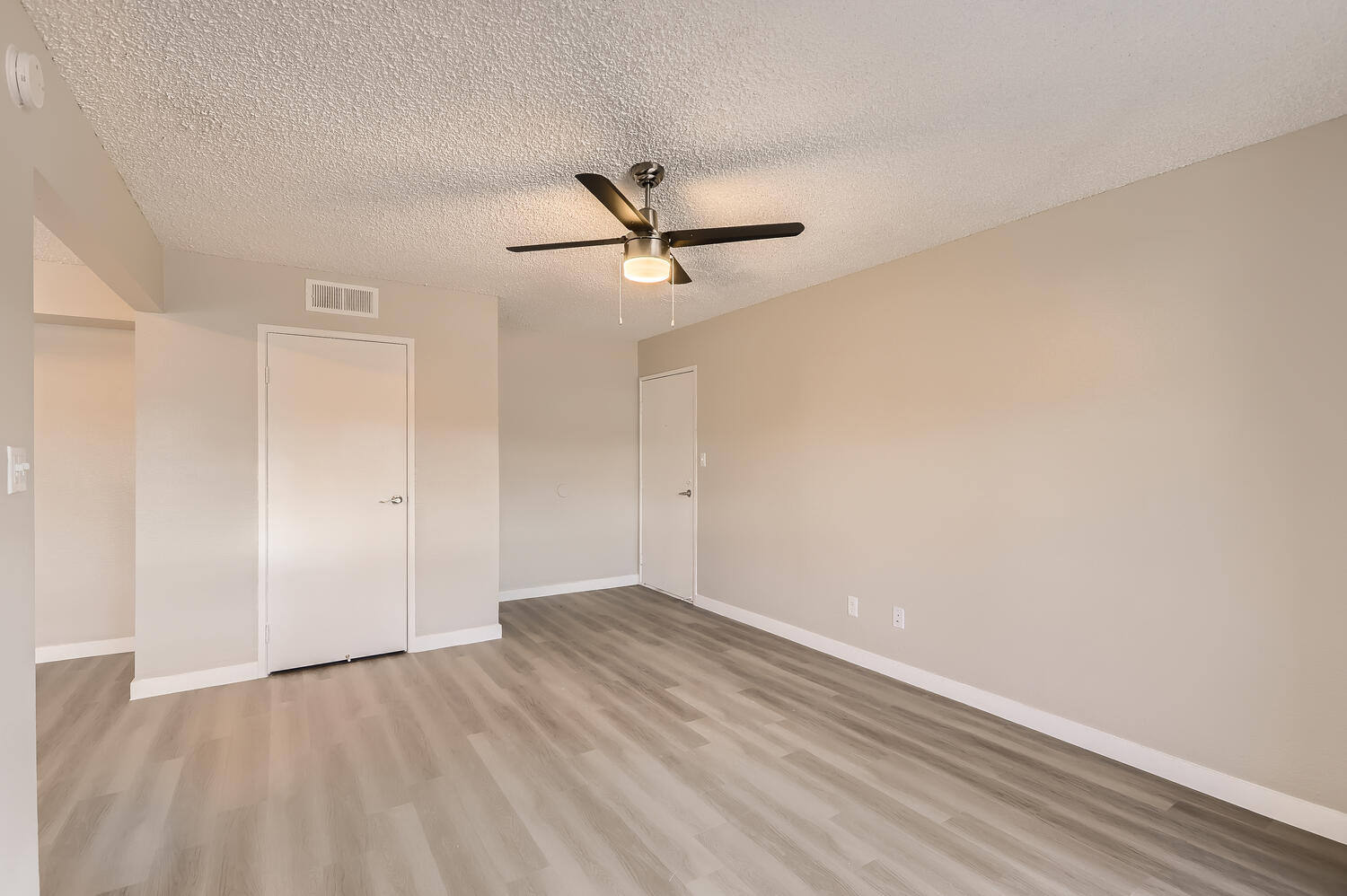 a kitchen with a wood floor