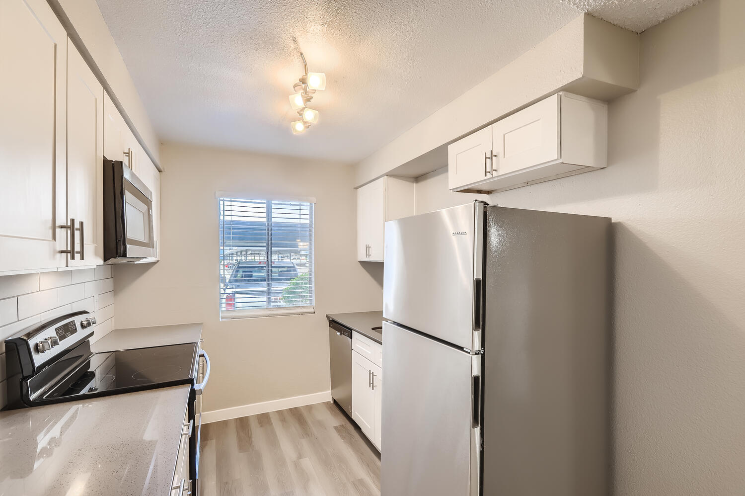 a stainless steel refrigerator in a kitchen