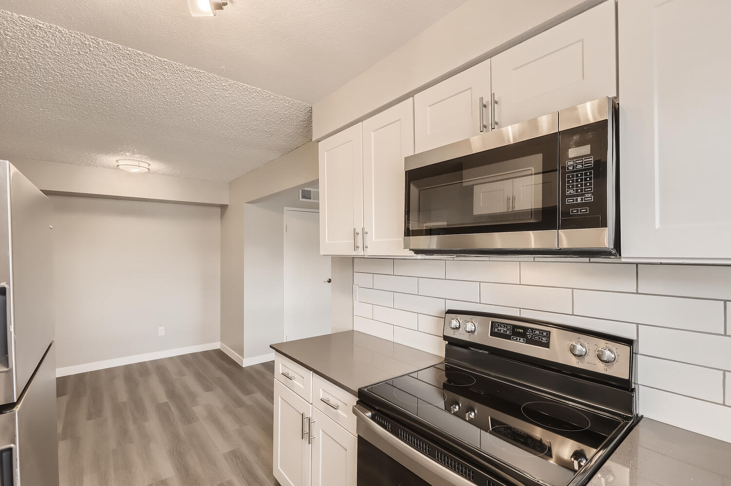 a stove top oven sitting inside of a kitchen