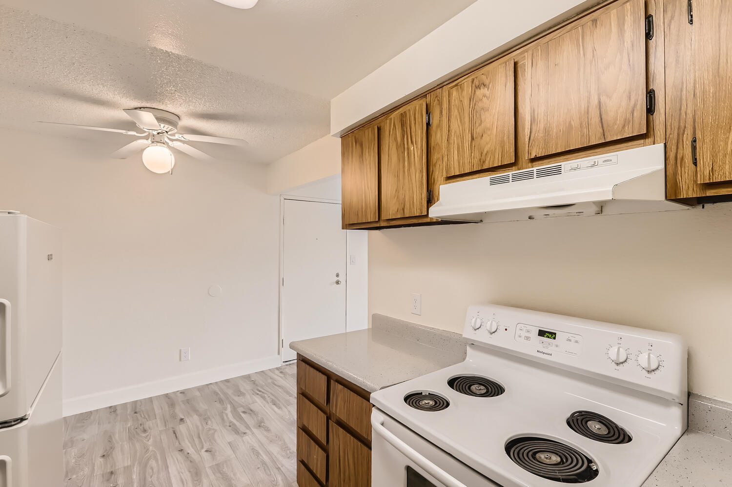 a stove top oven sitting inside of a kitchen