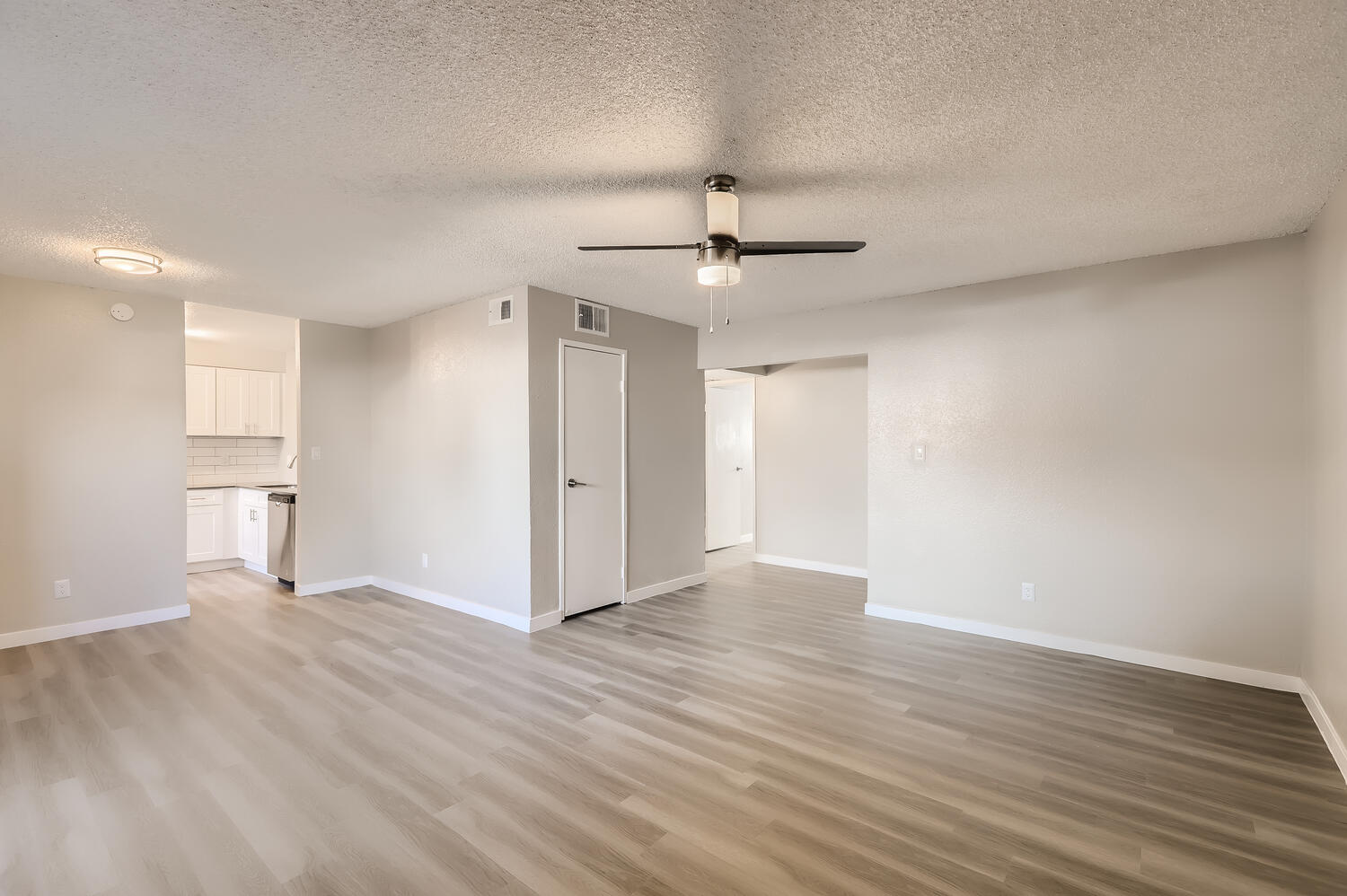 a large empty room with a wood floor