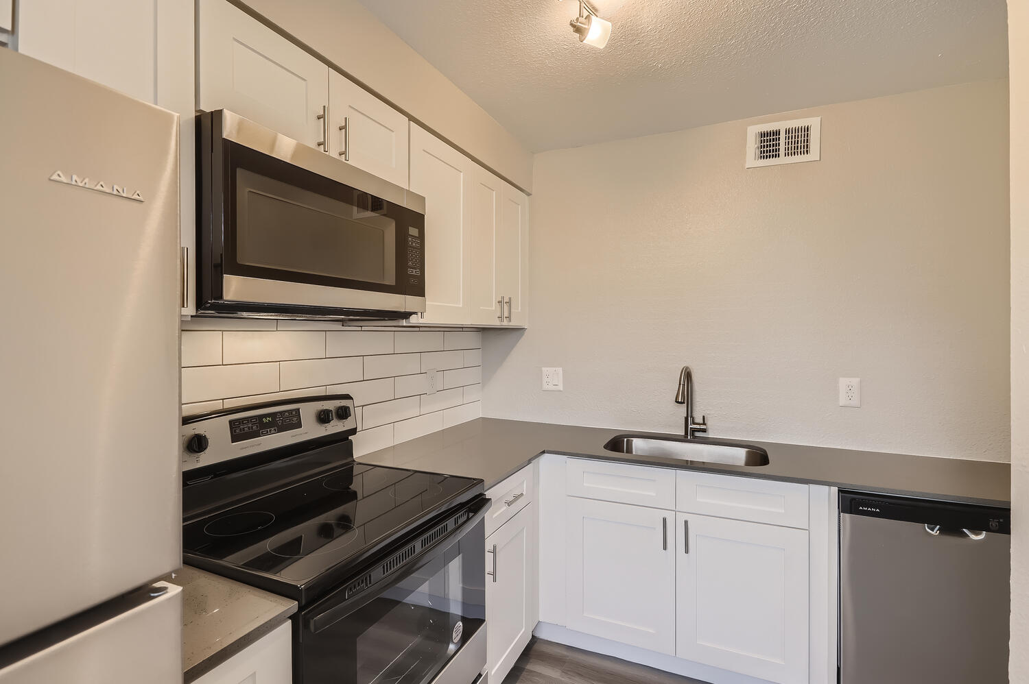 a kitchen with a stove top oven