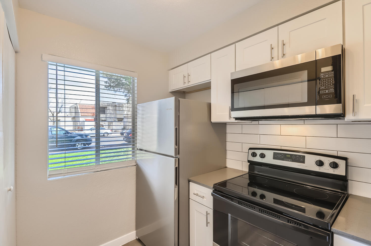 a stove top oven sitting inside of a kitchen