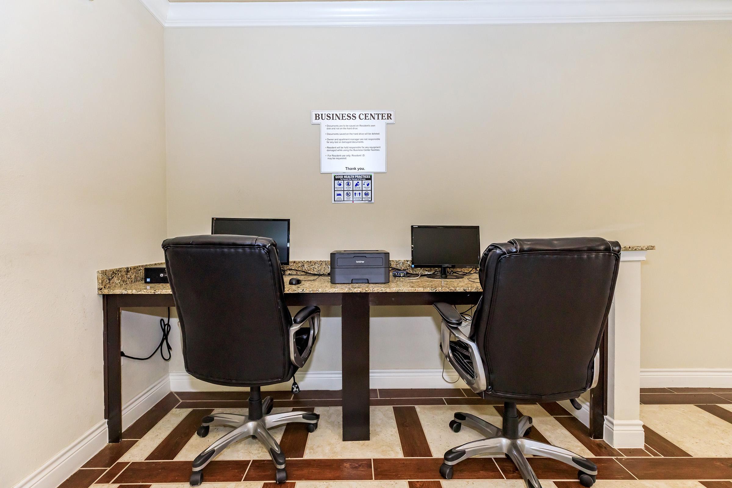 a laptop computer sitting on top of a chair