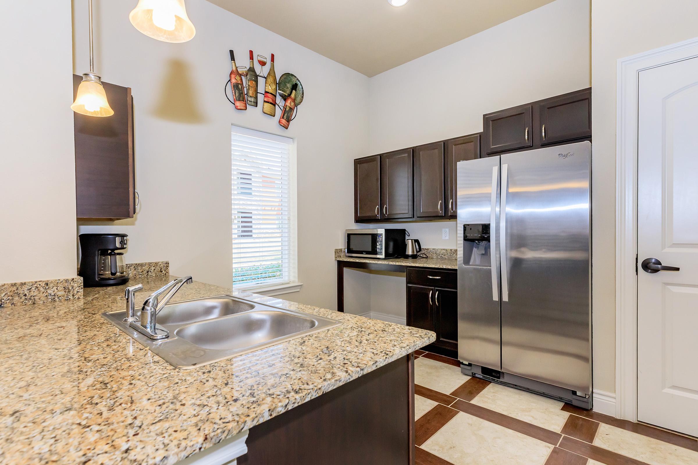 a modern kitchen with stainless steel appliances