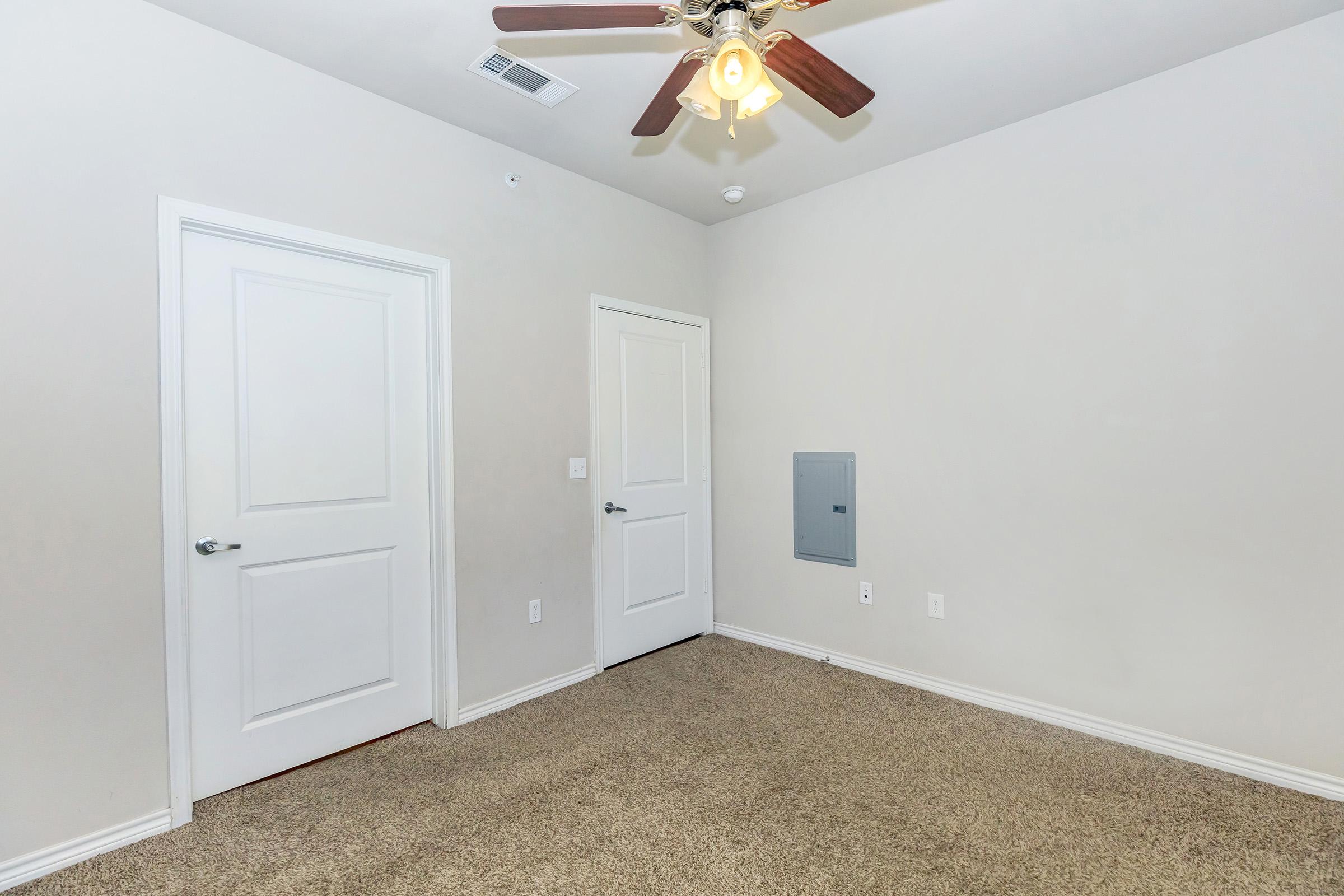 a bedroom with a large mirror