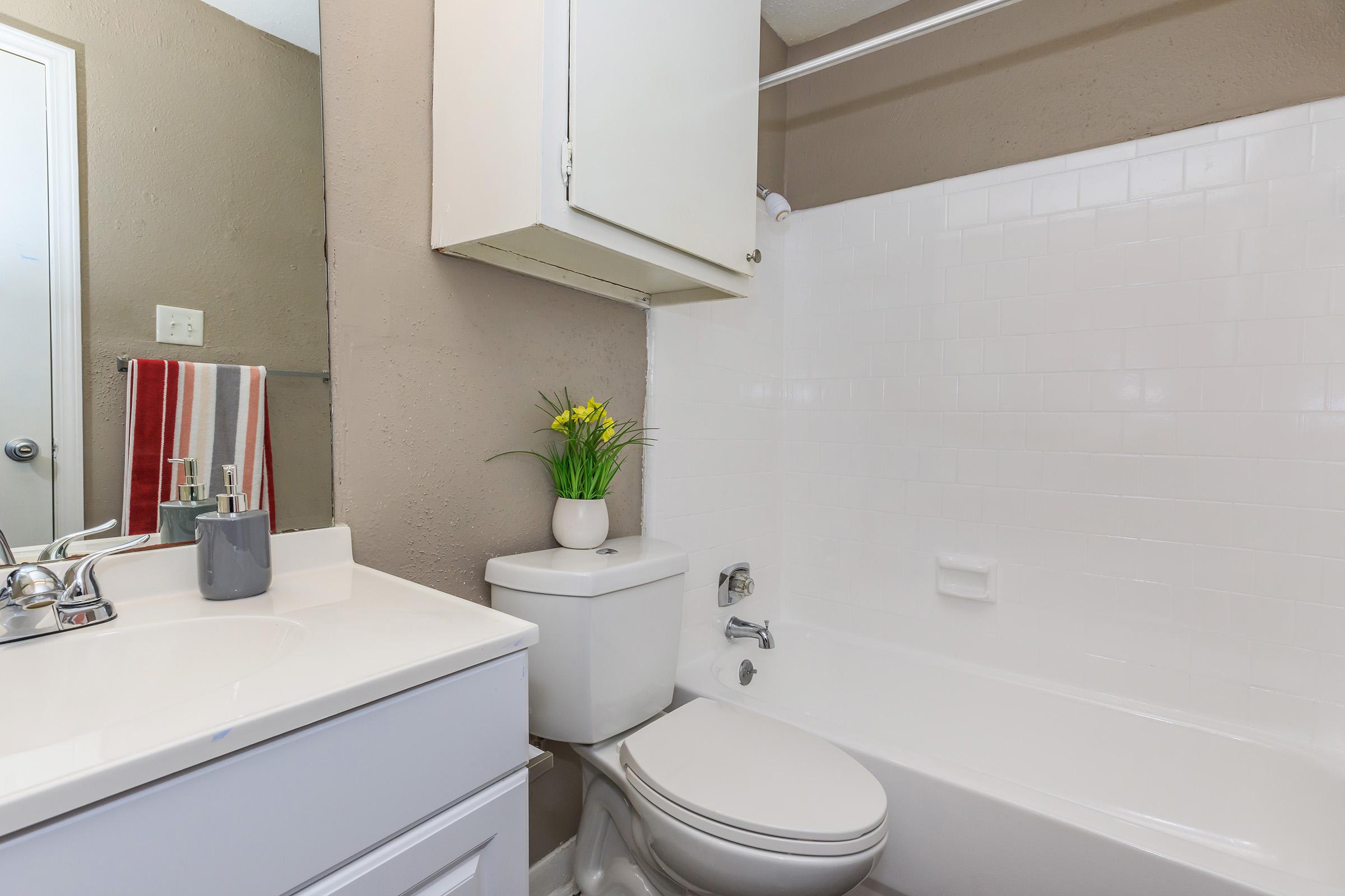 a room with a sink and a mirror