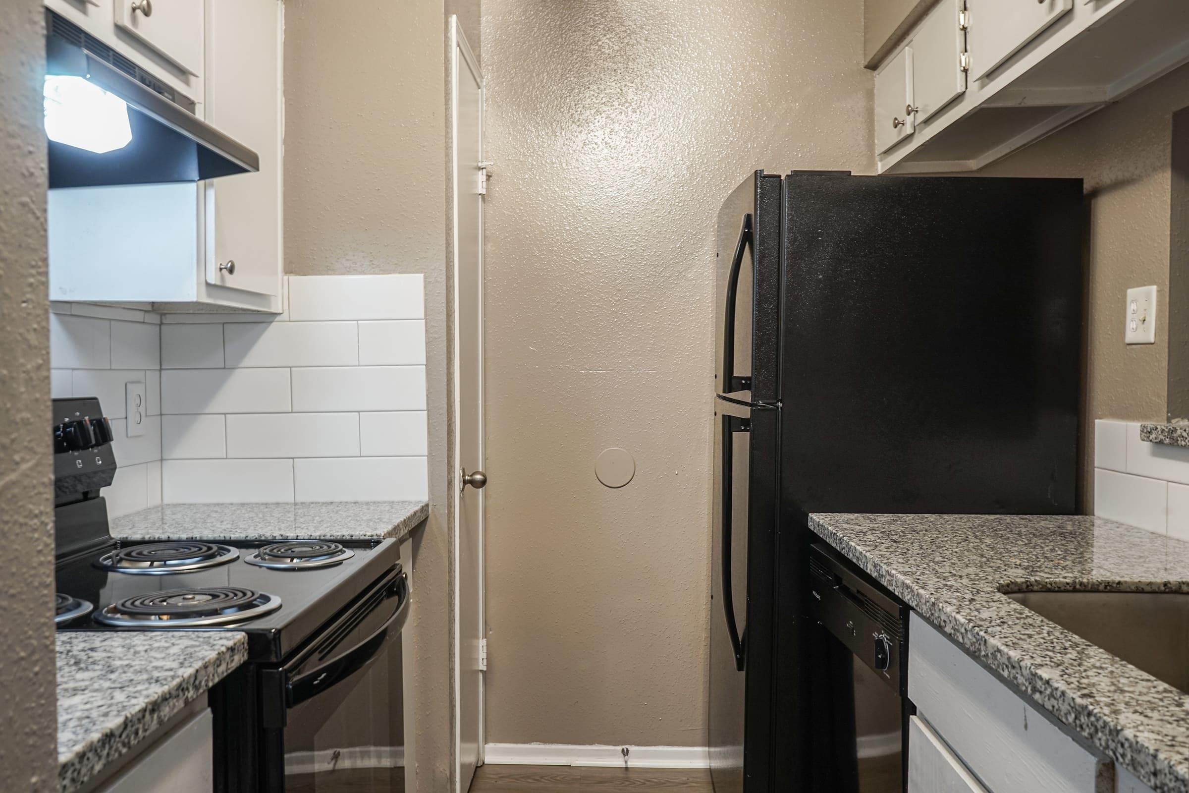 a modern kitchen with stainless steel appliances