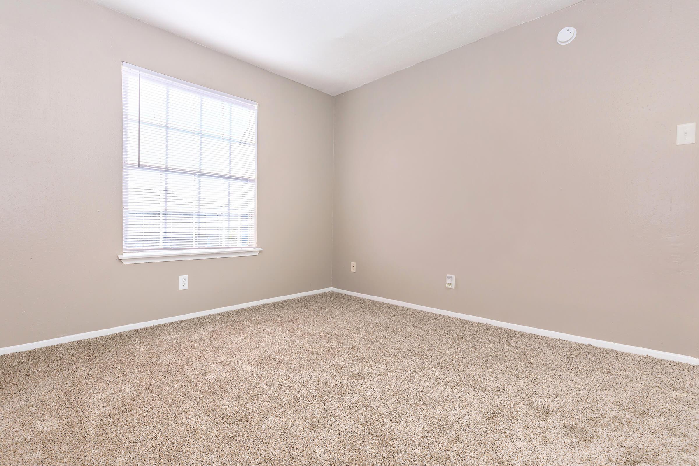 a bedroom with a large window