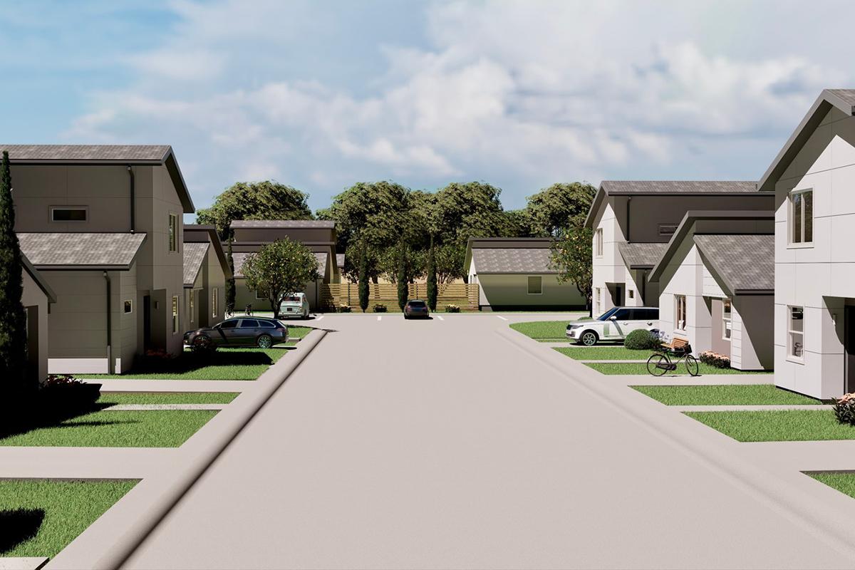 A residential street scene featuring modern houses on both sides, with green lawns and trees. Several vehicles are parked along the road, including a bicycle. The view shows a clear sky with some clouds, and a pathway leading up to steps in the distance. The overall atmosphere is tranquil and suburban.