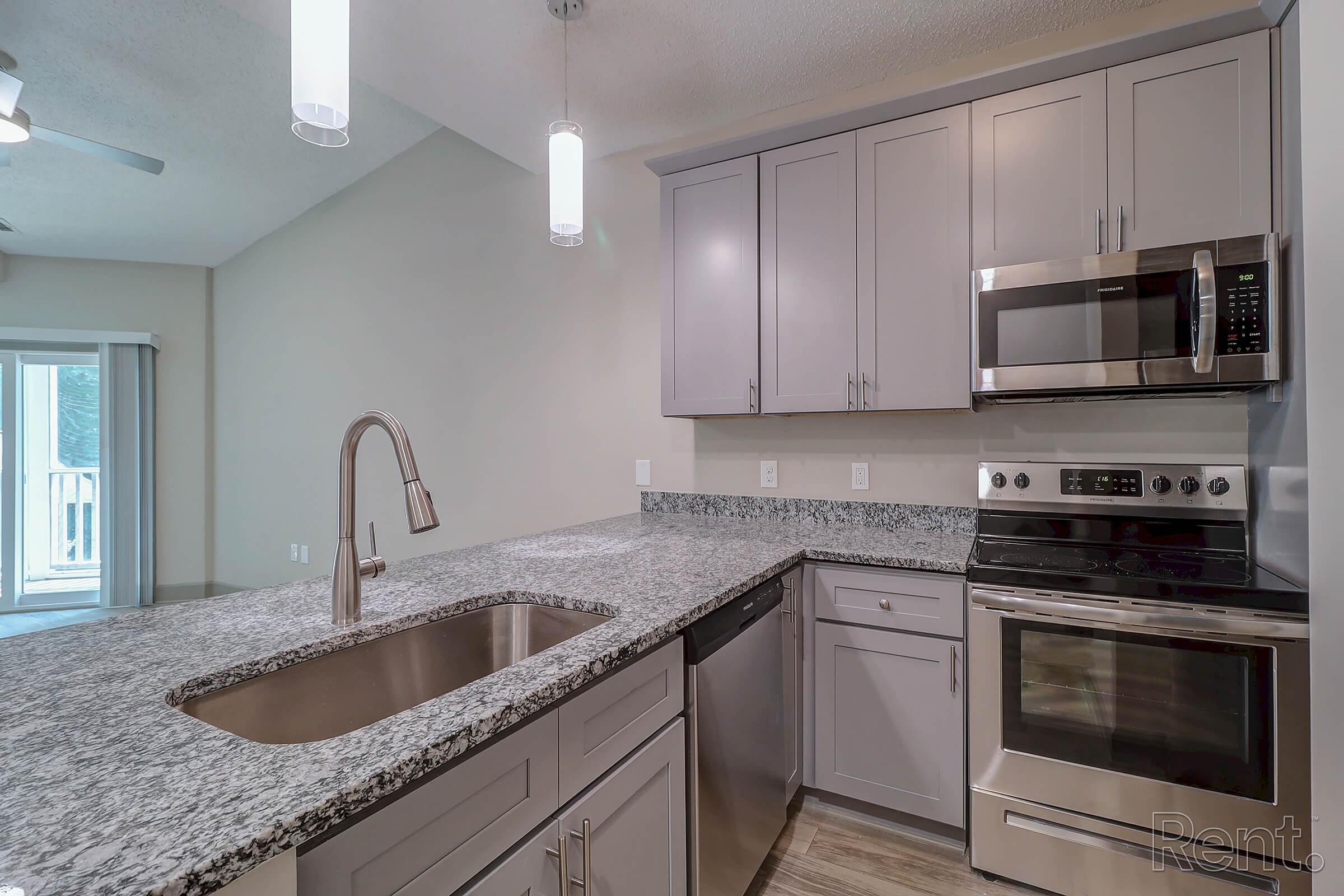 a modern kitchen with stainless steel appliances