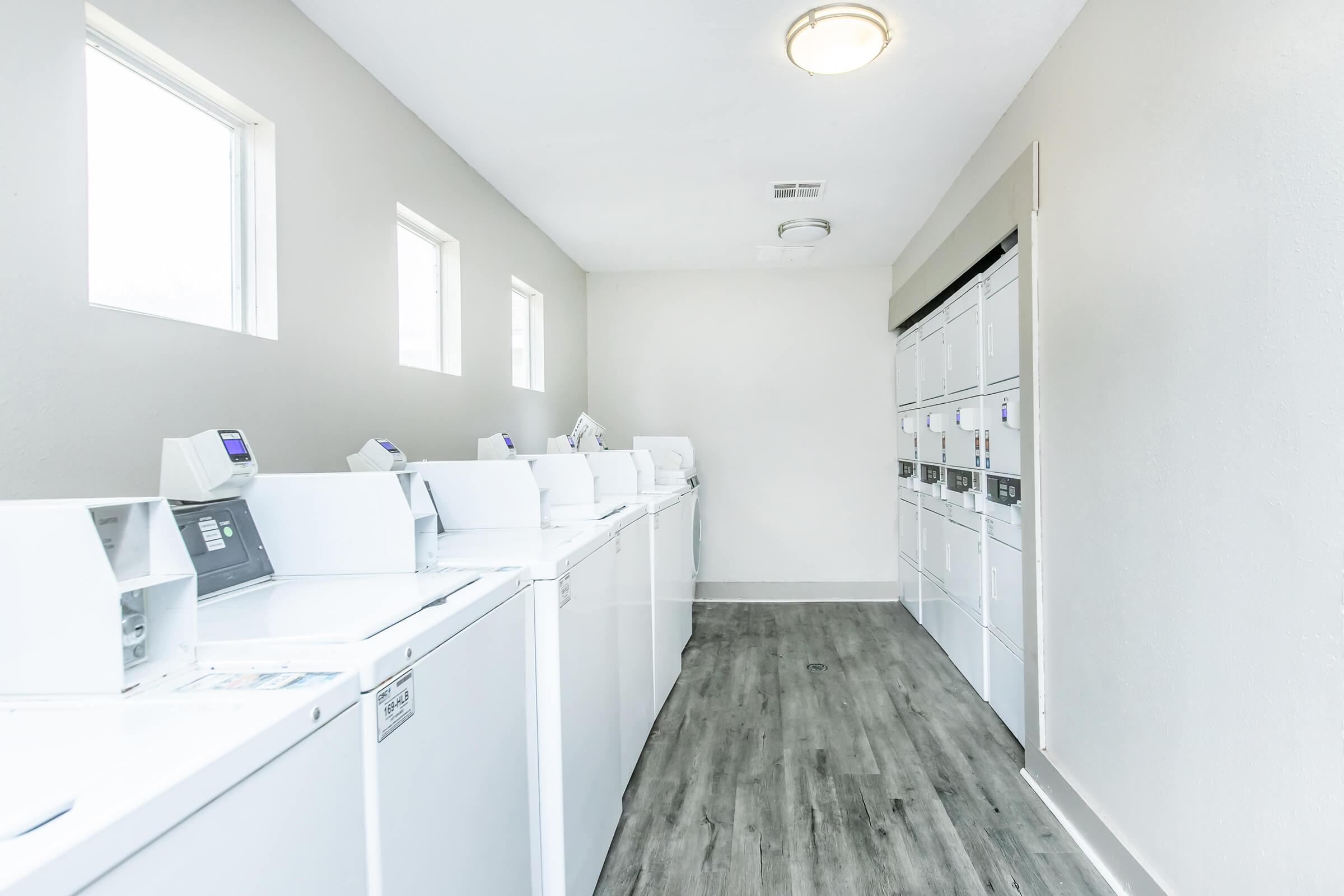 a kitchen with a sink and a refrigerator