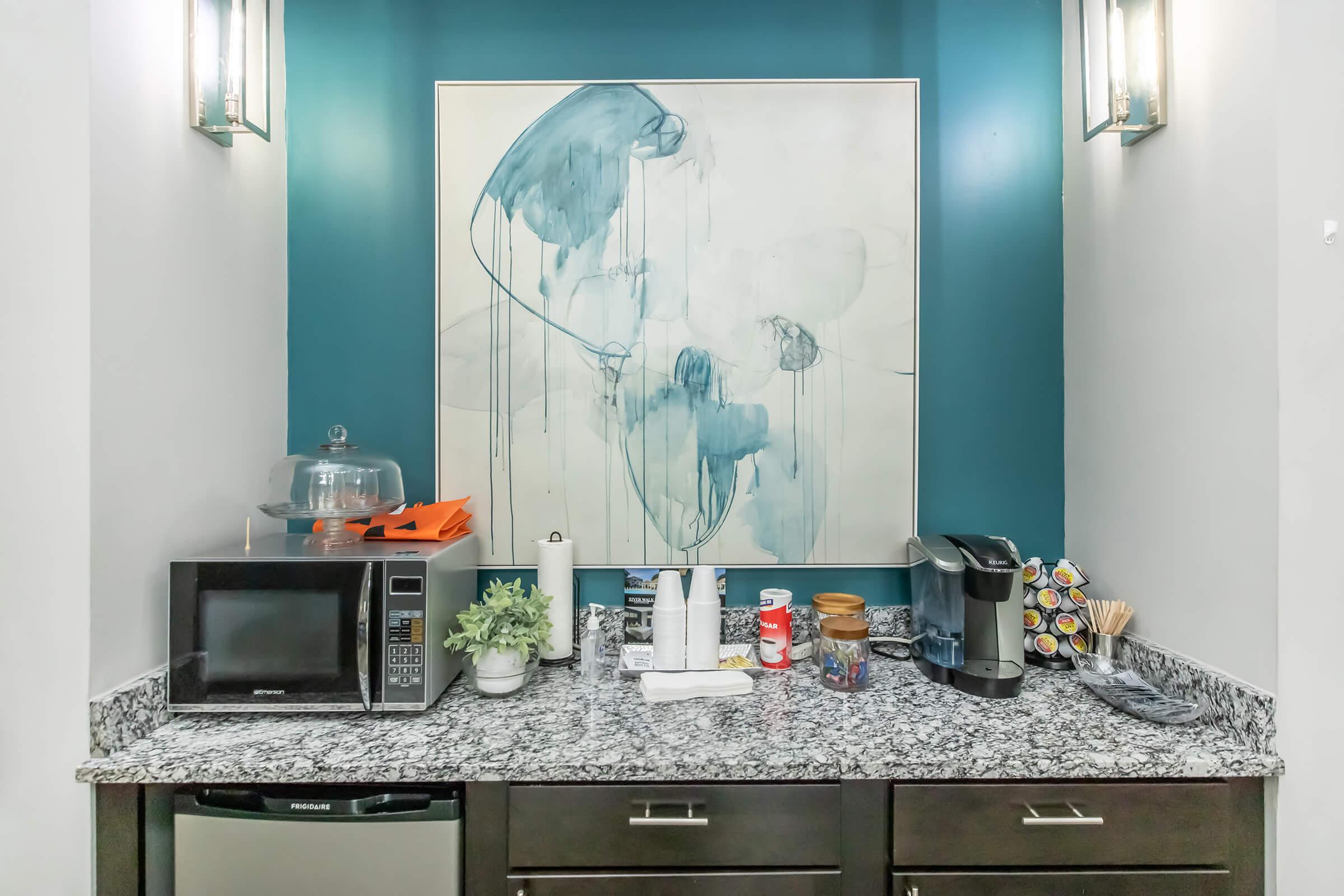 a kitchen with a sink and a microwave