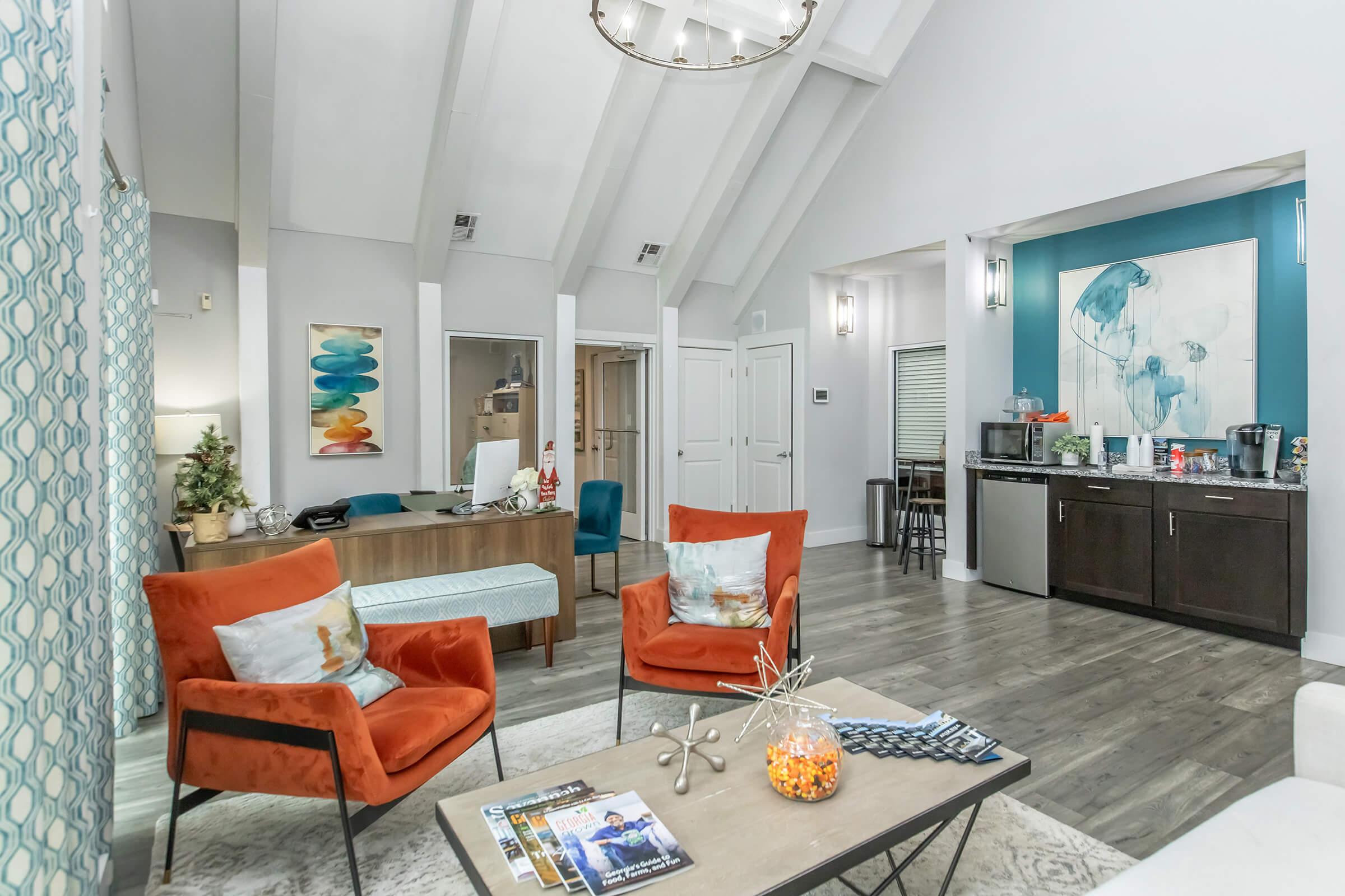 a living room filled with furniture and a mirror