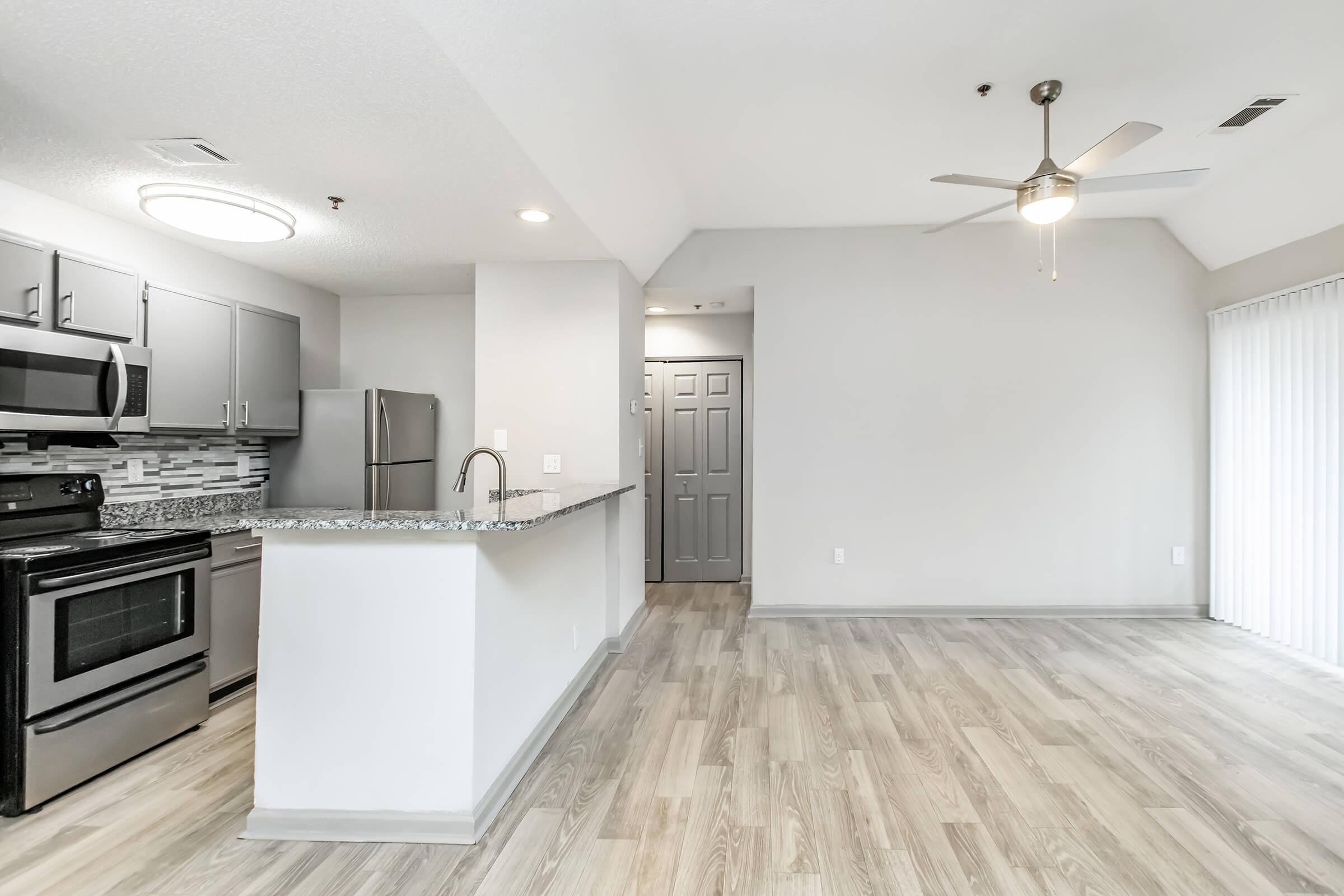 a kitchen with a wood floor