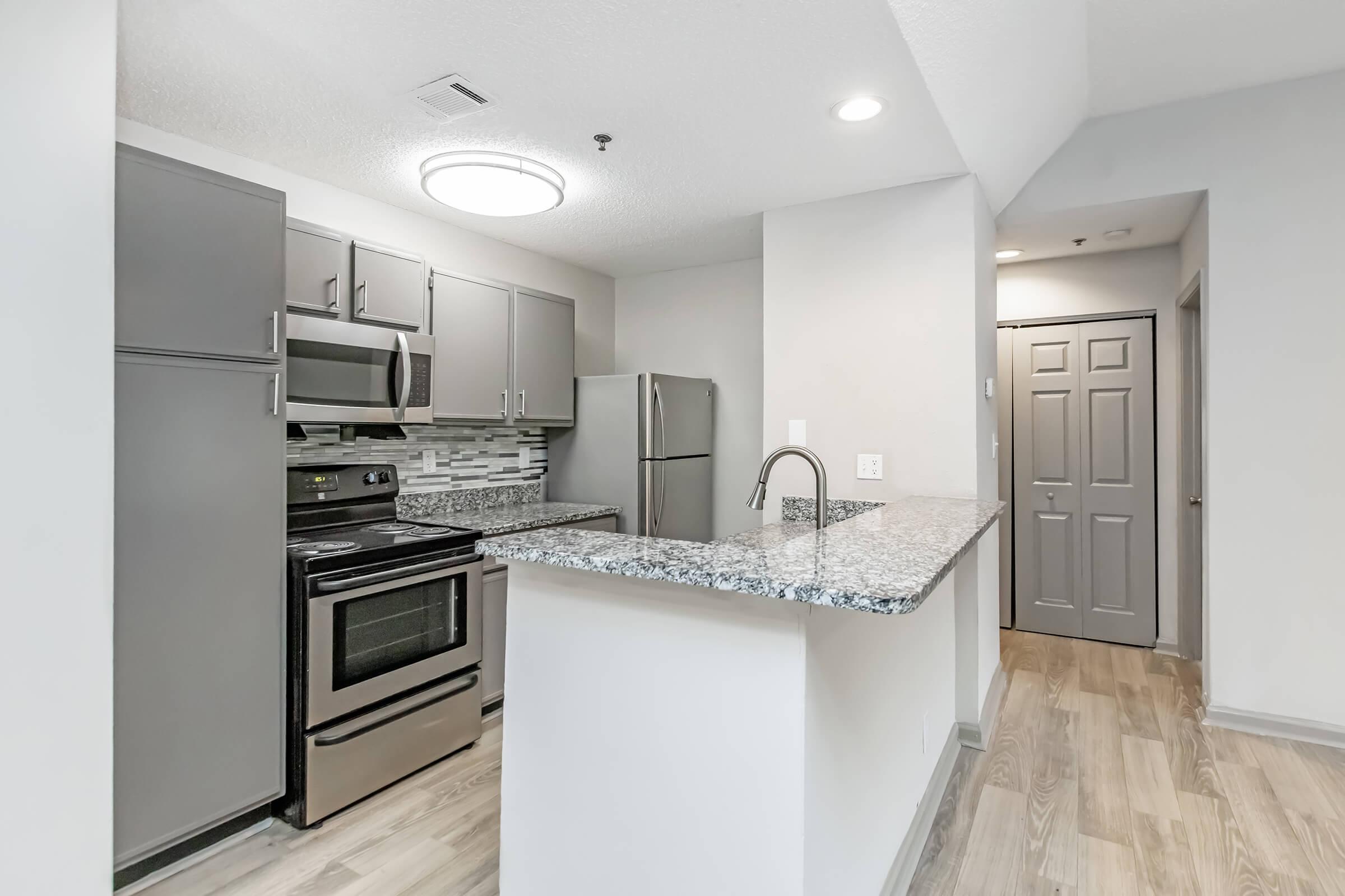 a modern kitchen with stainless steel appliances