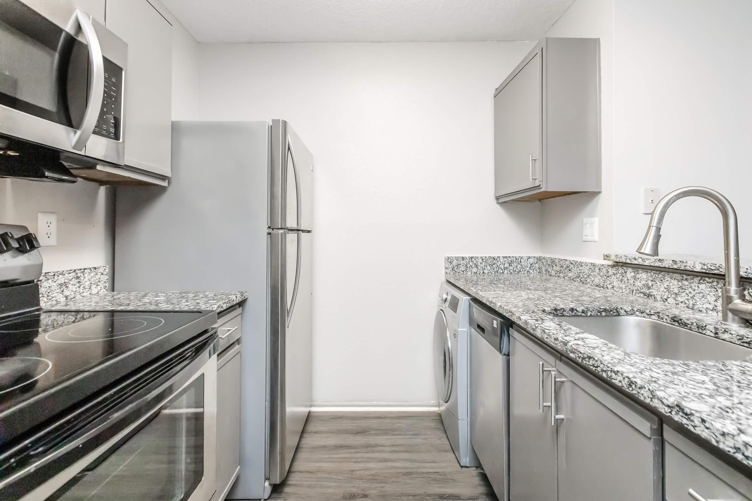 a kitchen with stainless steel appliances