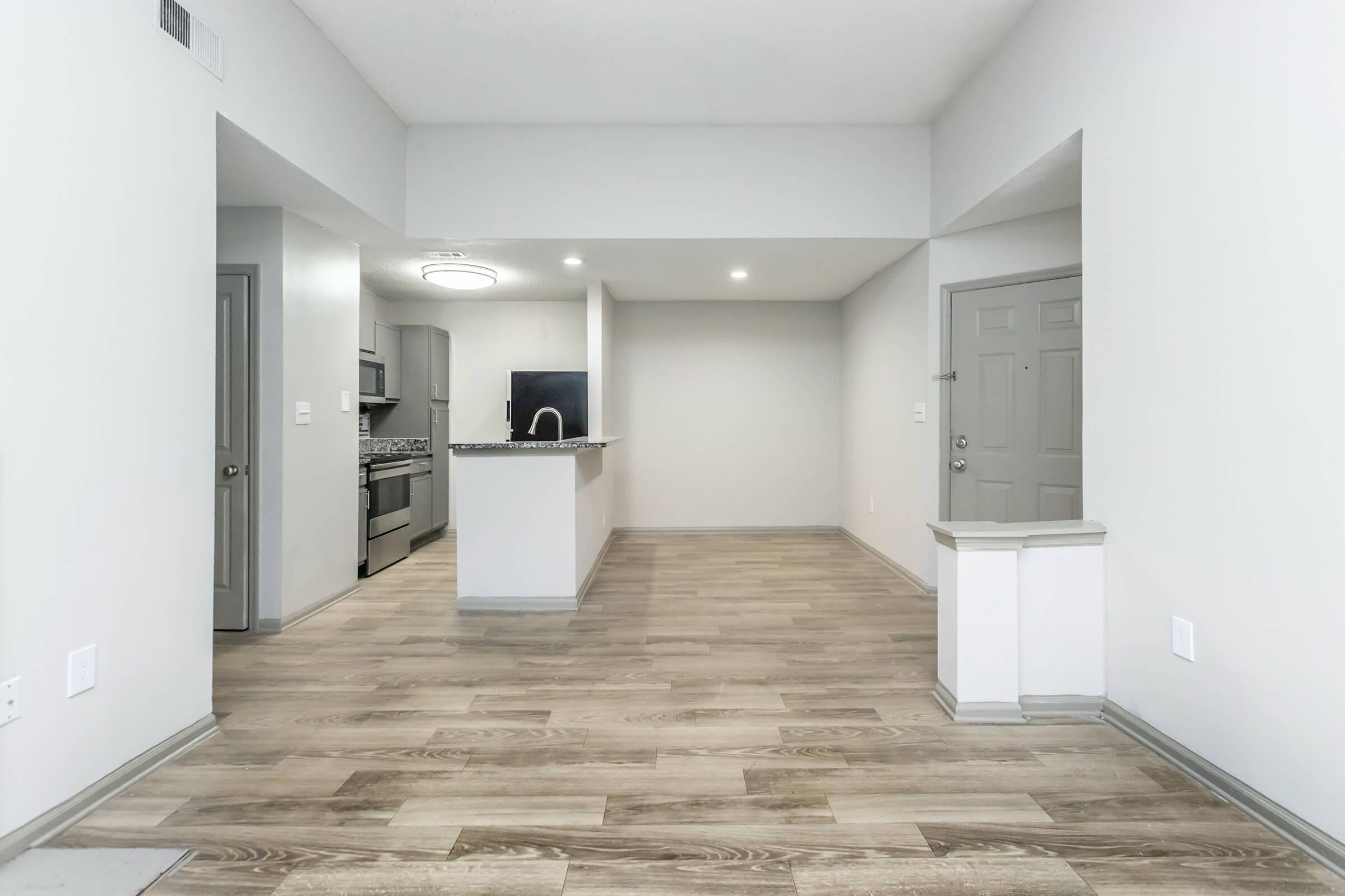 a kitchen with a building in the background