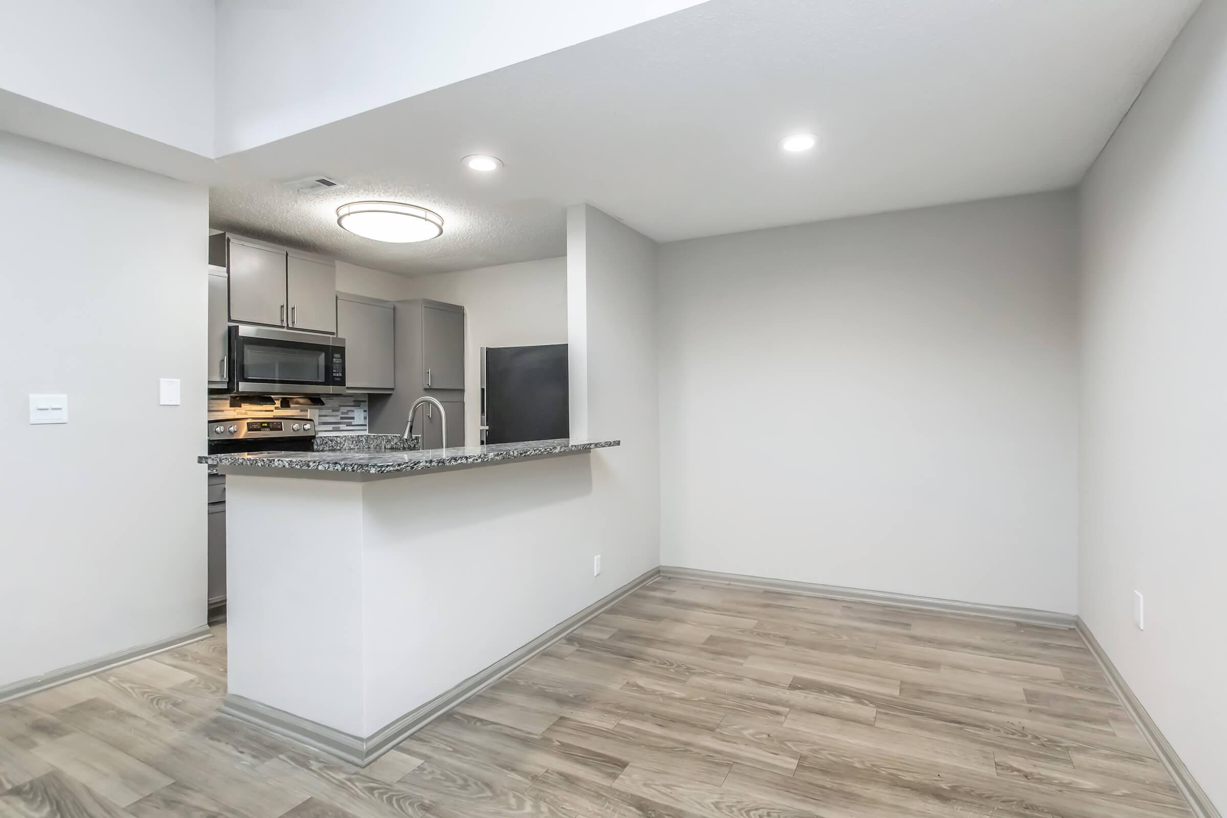 a kitchen with a wood floor