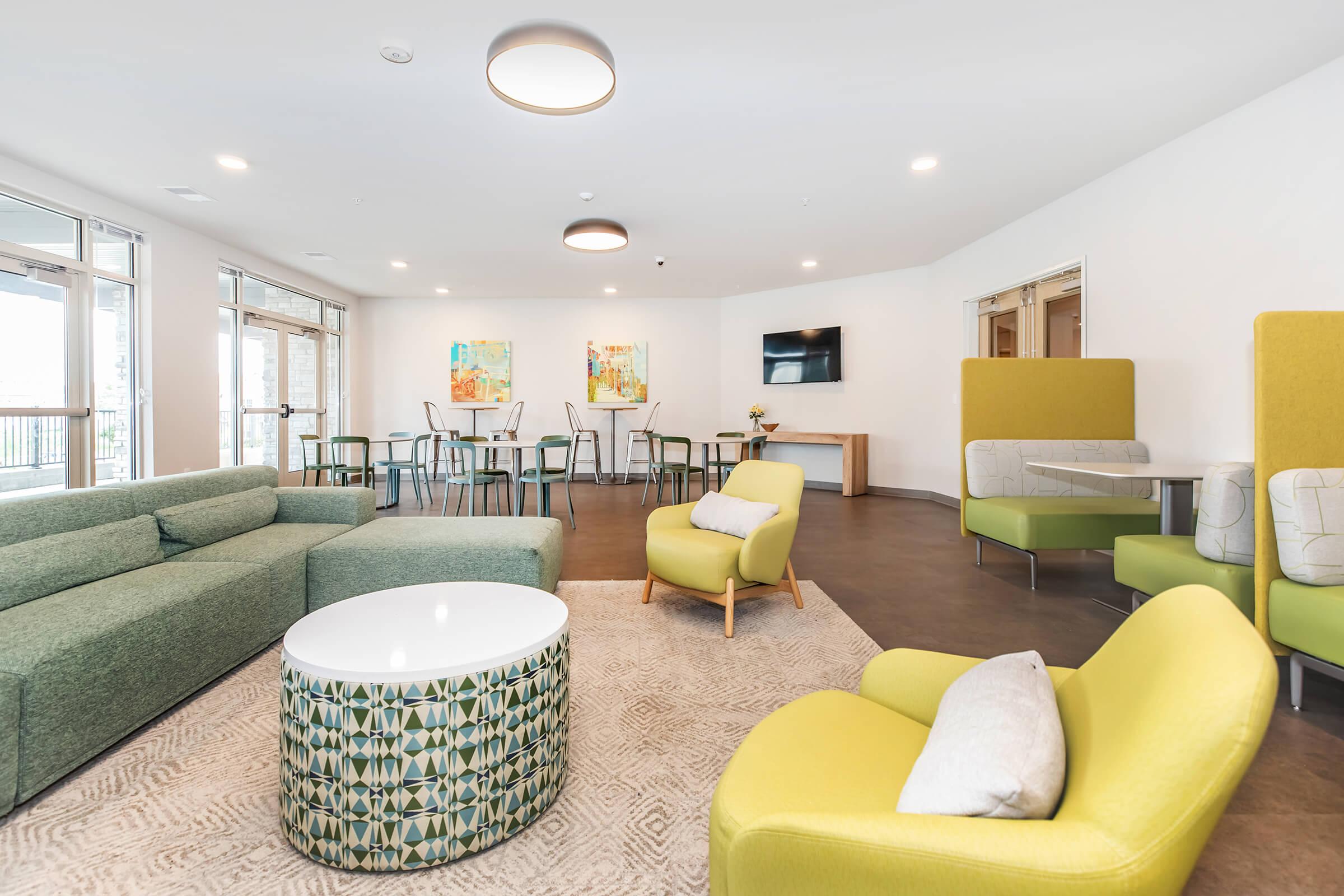 a living room filled with furniture and a table