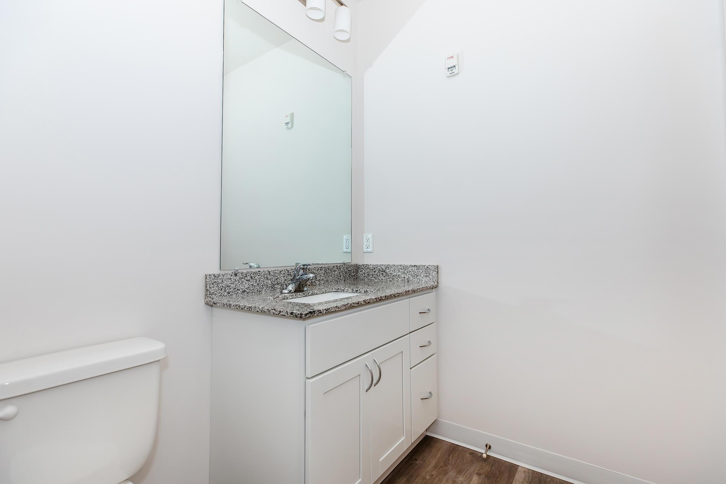 a close up of a sink and a mirror