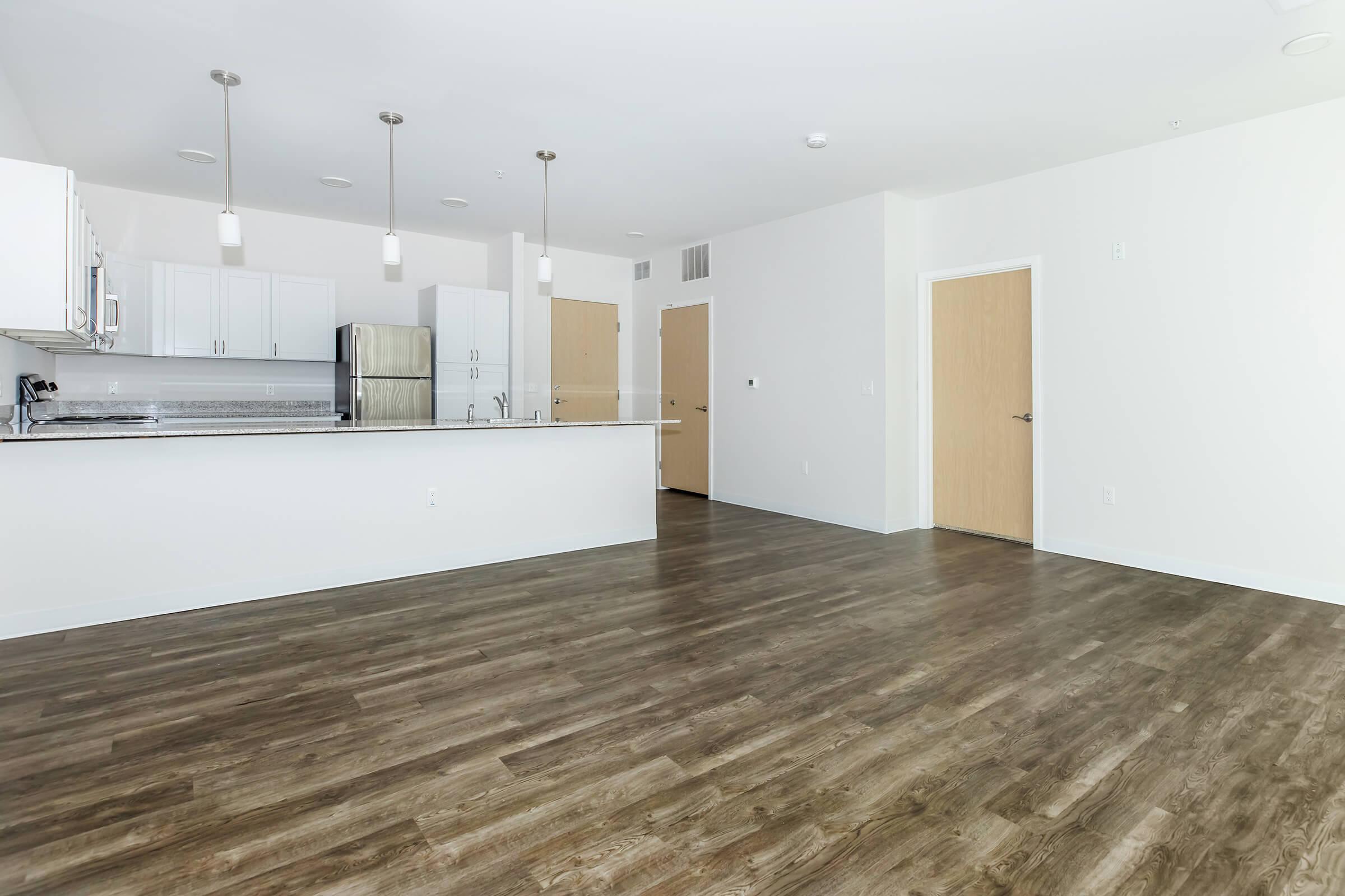 a kitchen with a wooden floor