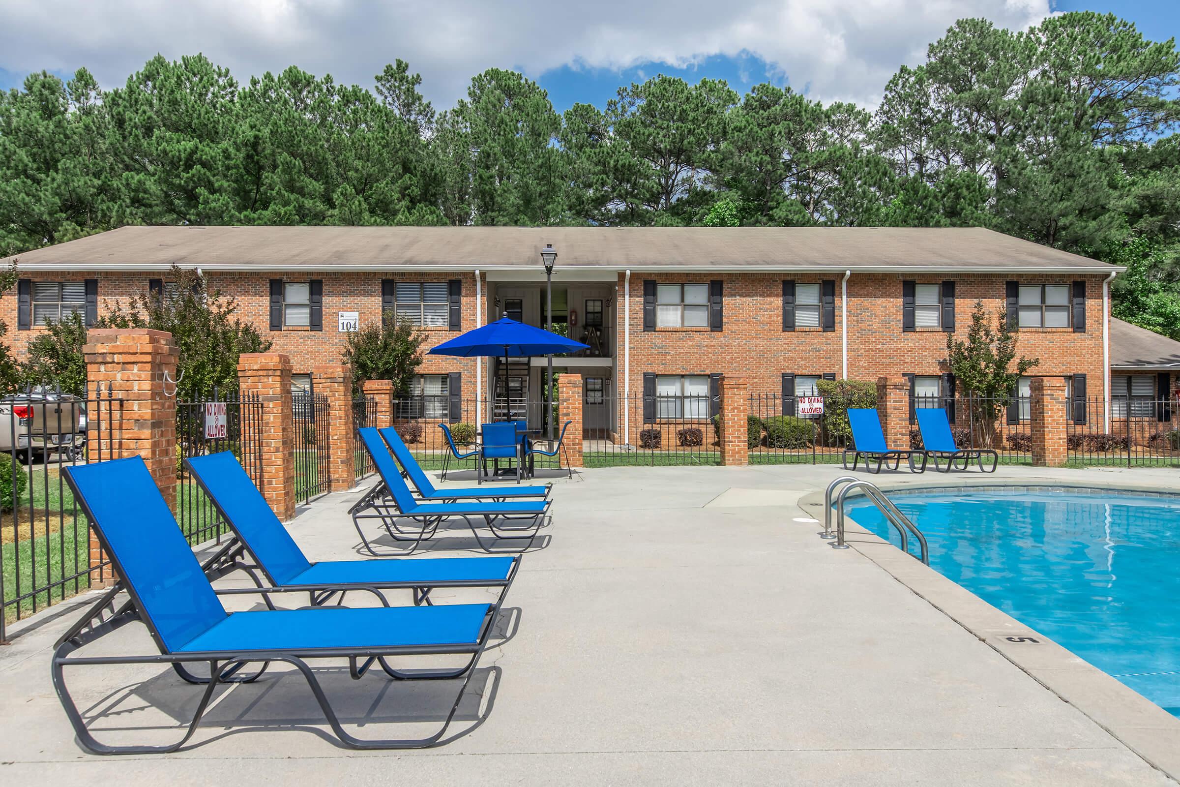 a blue bench in a pool