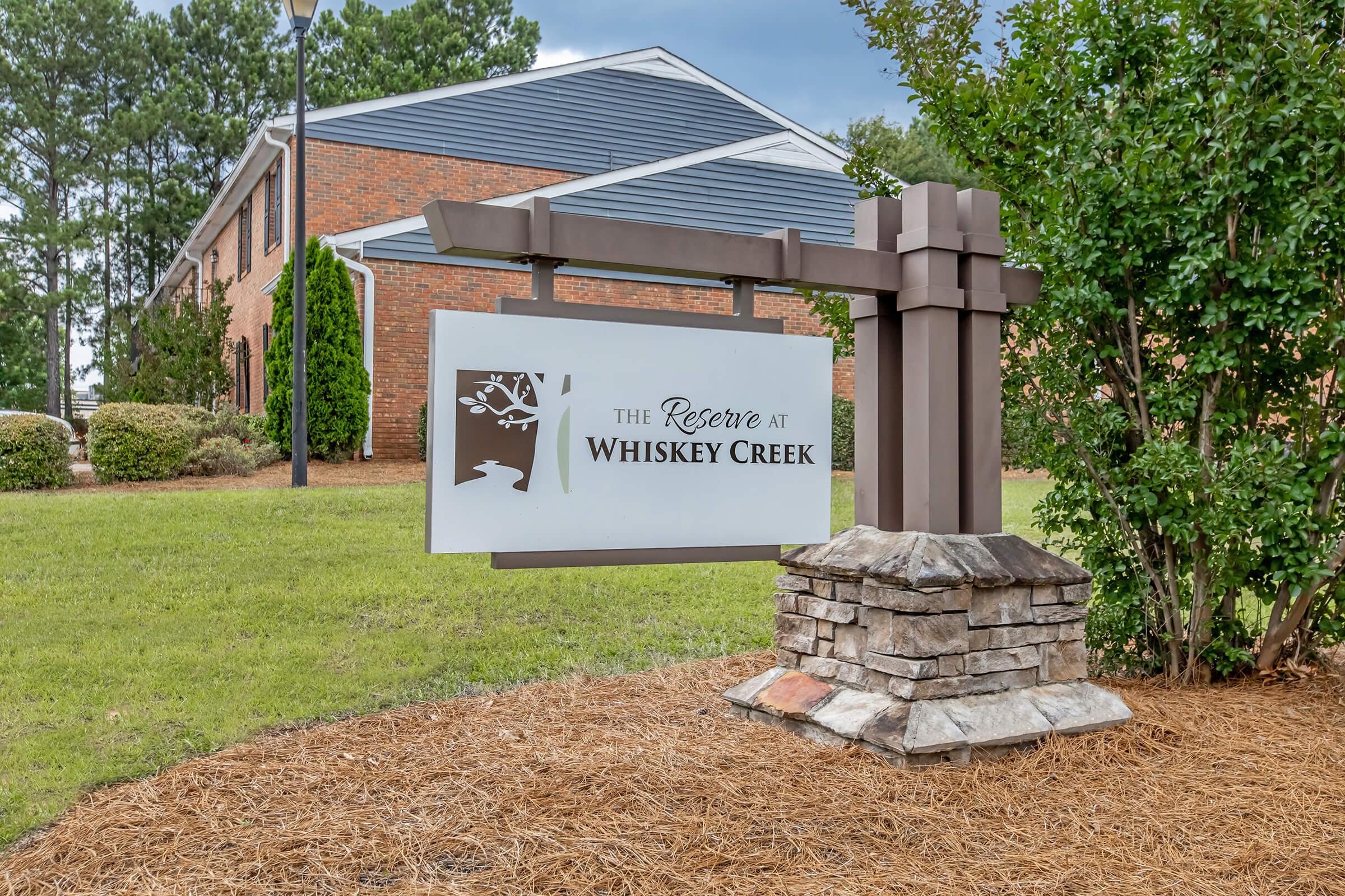 a sign in front of a house