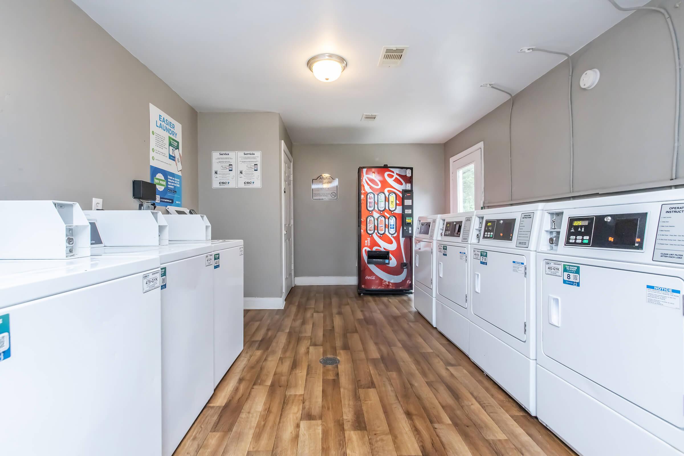 a kitchen with a sink and a refrigerator